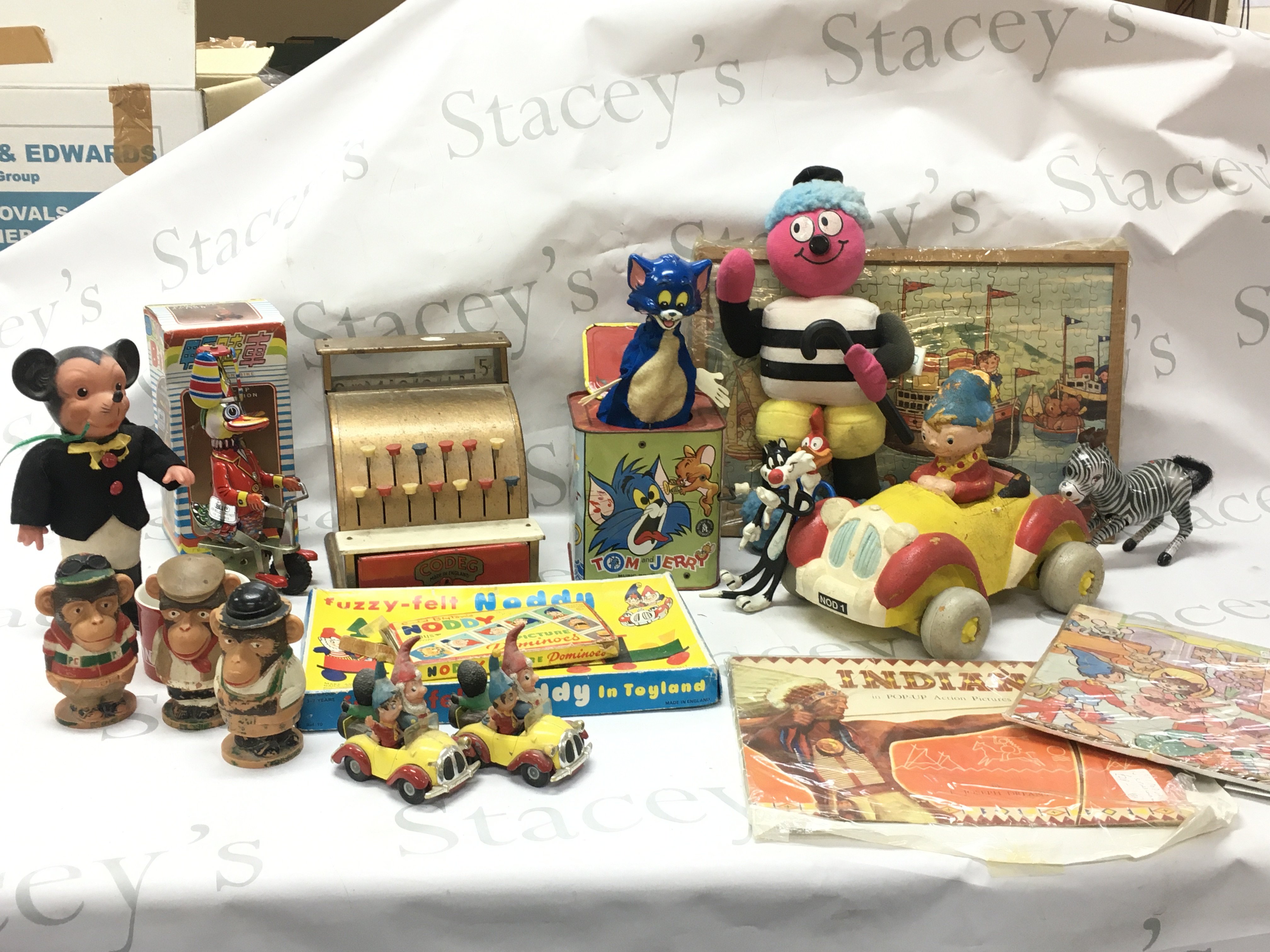 A collection of vintage toys including a Mattel Tom and Jerry music box , Diana Jones Bassetts man, Corgi noddys car, tin plate duck on bike. Postage category C x 2