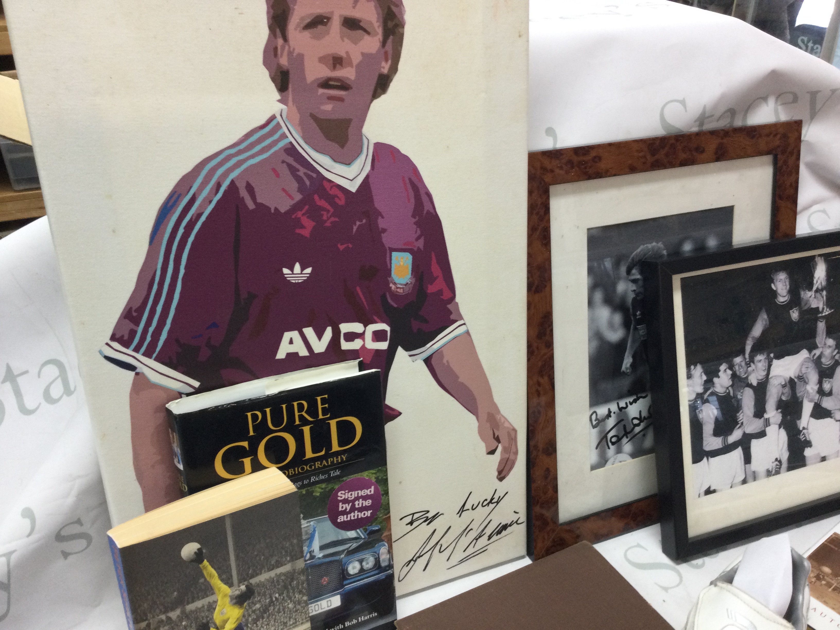 A collection of West Ham United football memorabilia including signed books, prints, players signed boot featuring signatures by Frank McAvennie , Tony Cottee and Mark Ward etc. this lot cannot be posted