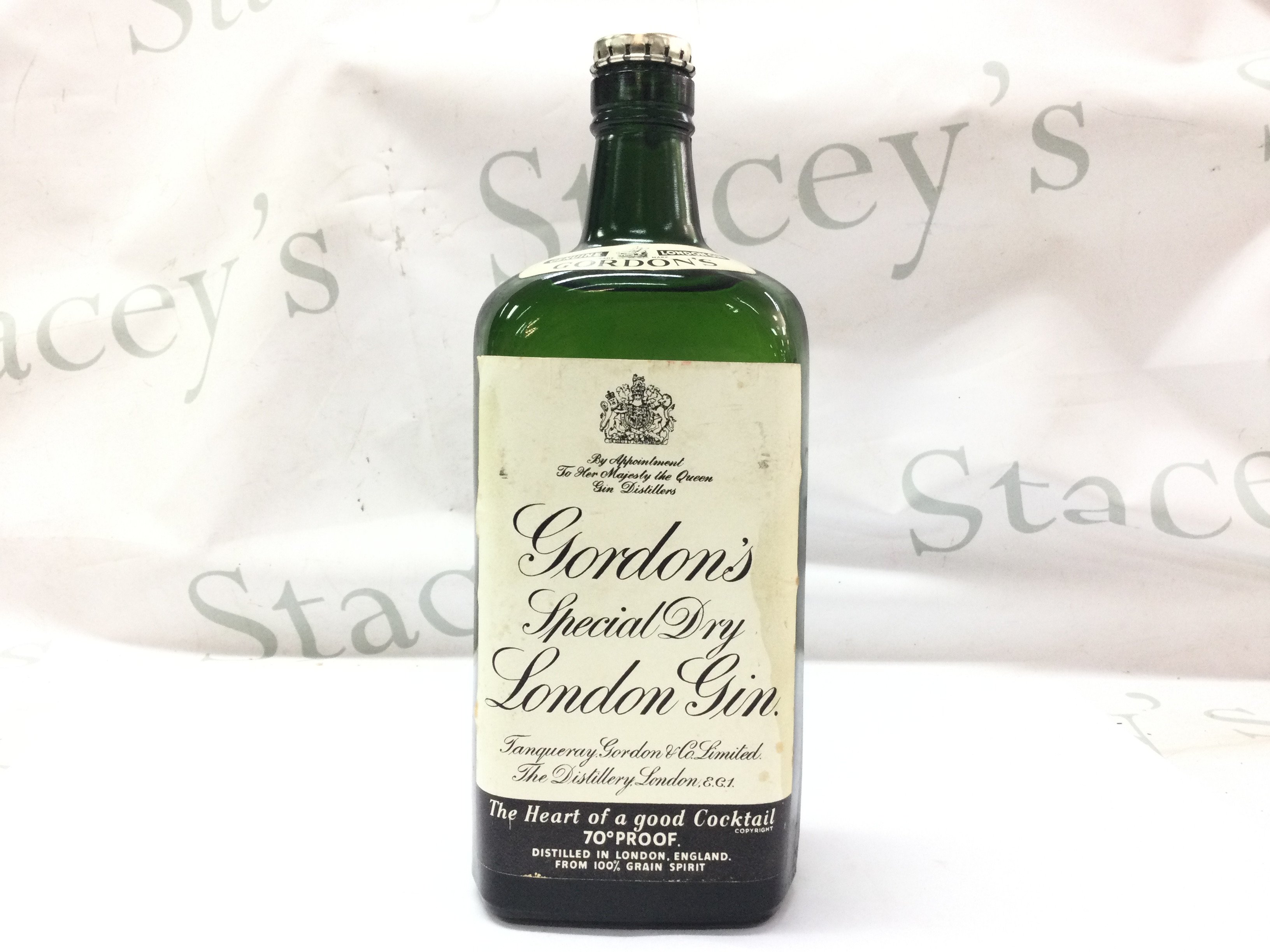A vintage bottle of Gordons Gin. This lot cannot be posted