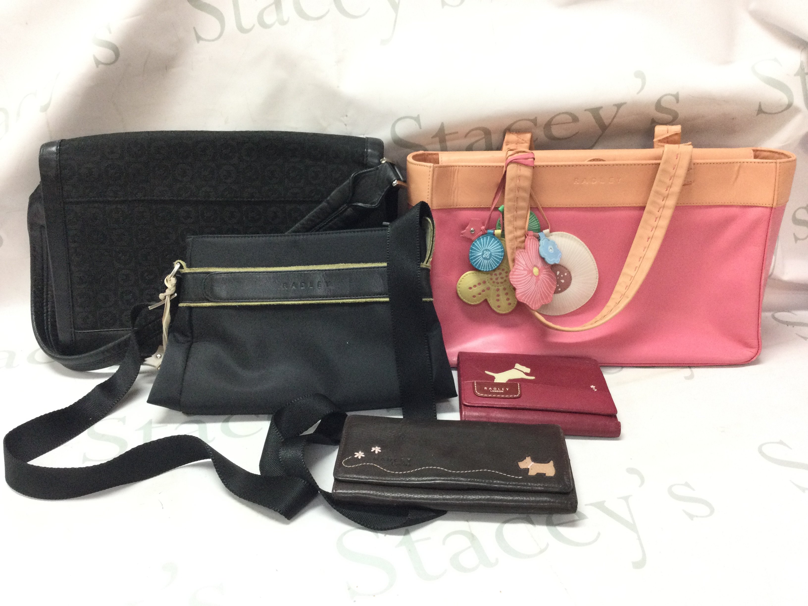 Three genuine ladies Radley handbags and two Radley purses . Postage category C
