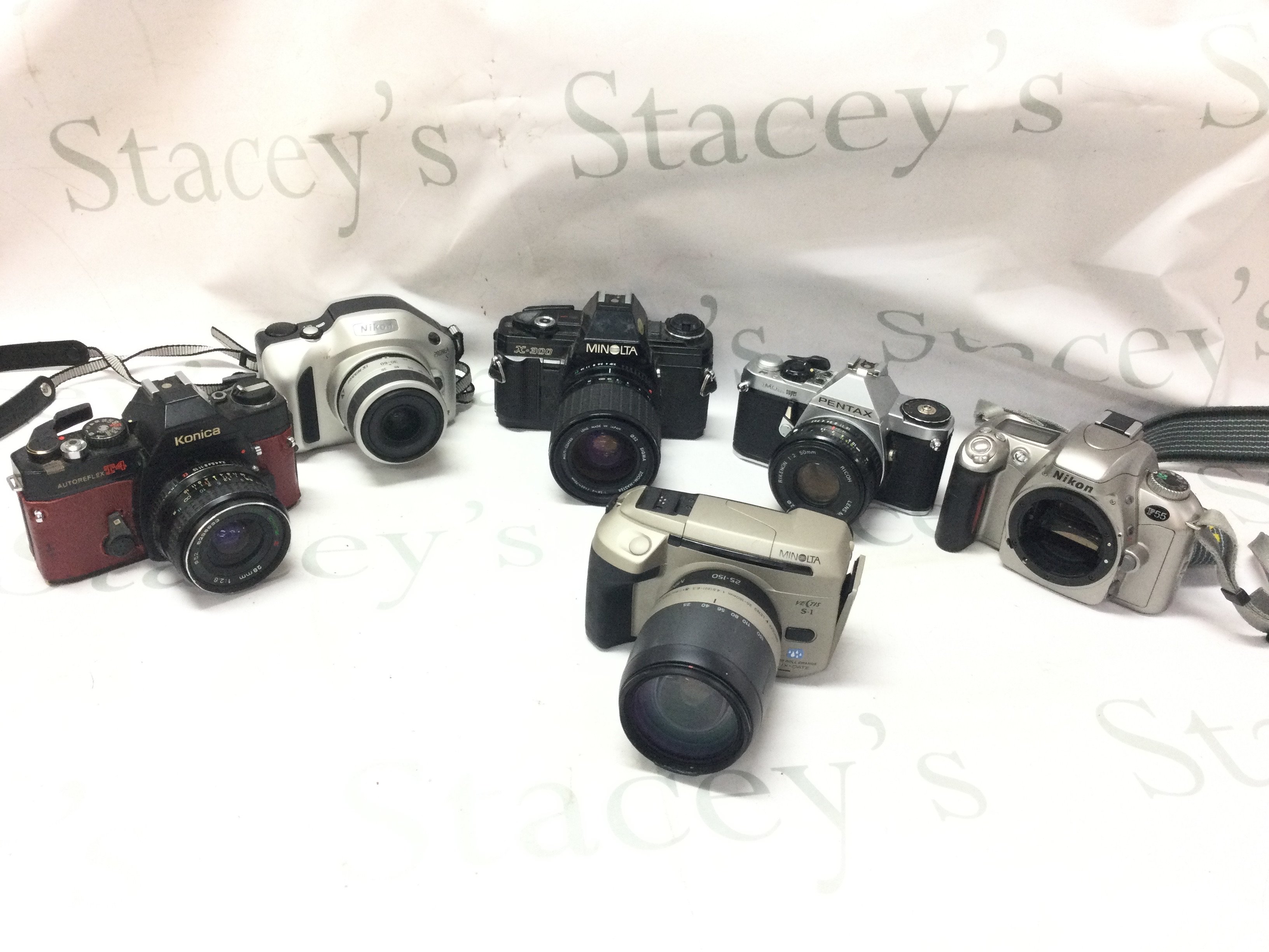 Six vintage cameras including Nikon, Konica, Pentax, Minolta . Postage category c