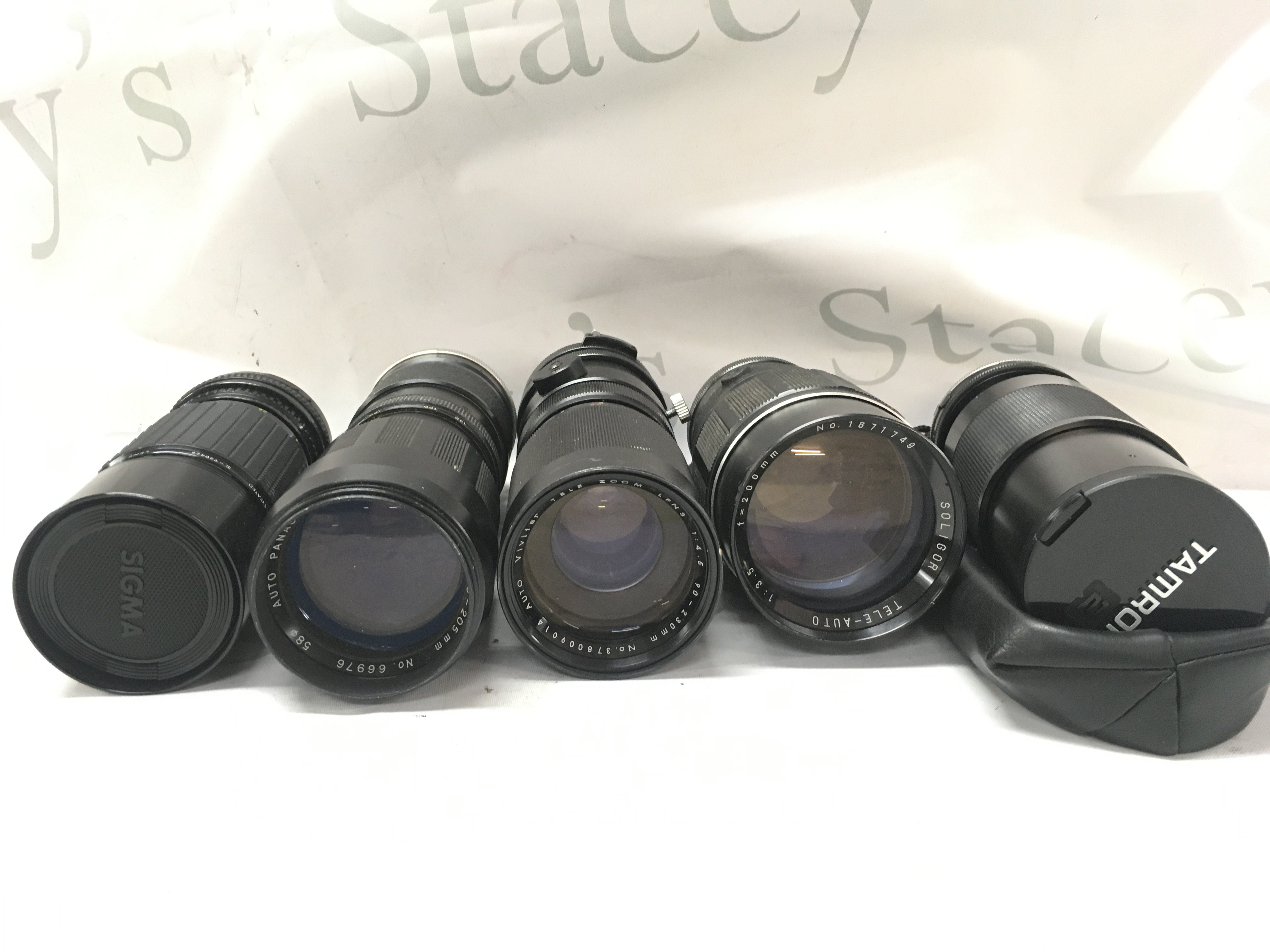 Five camera lenses including Sigma, Tele lenses, Tamron etc . Postage category C