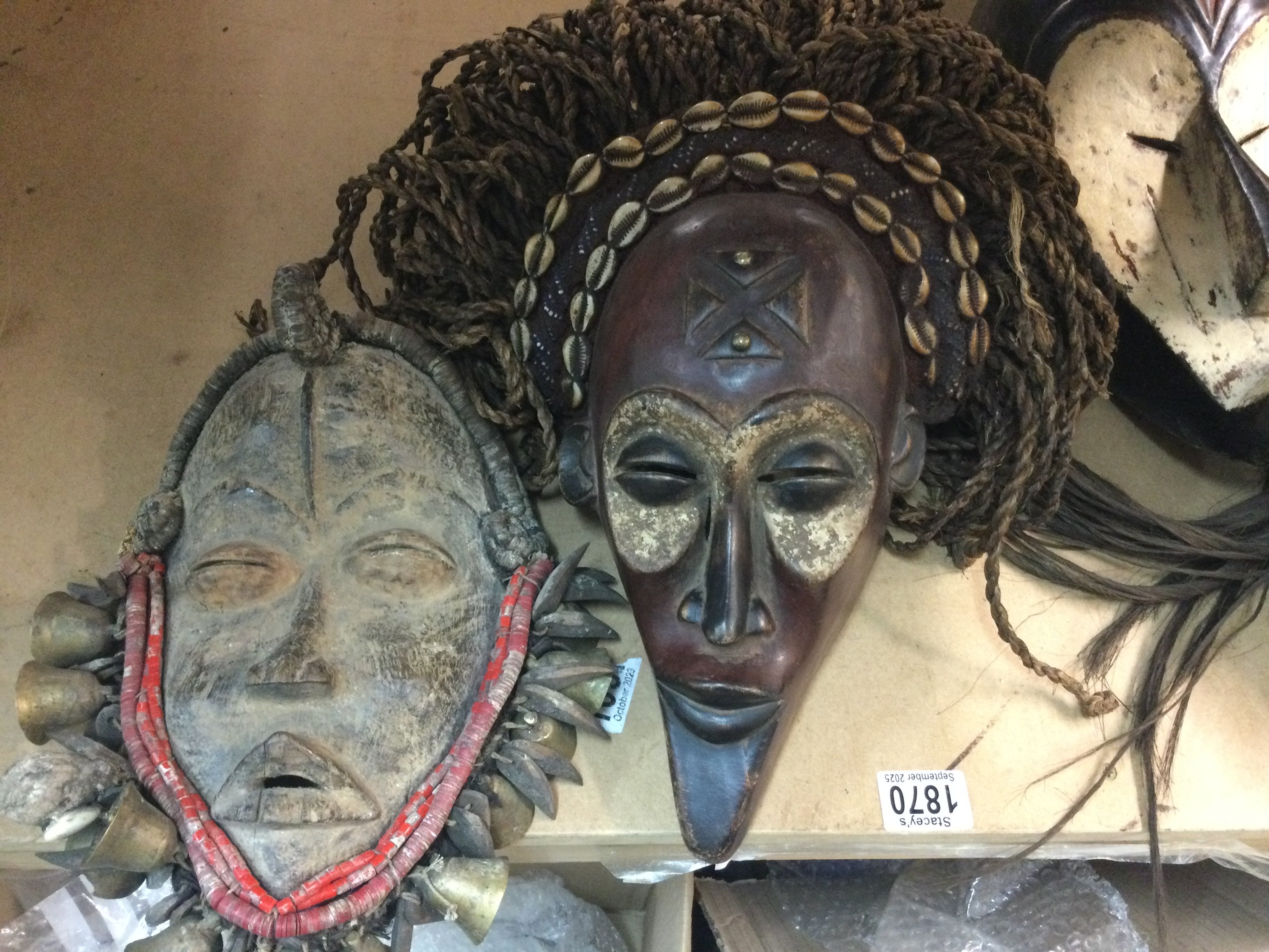 A collection of six African tribal masks including ceremonial and chokwe .