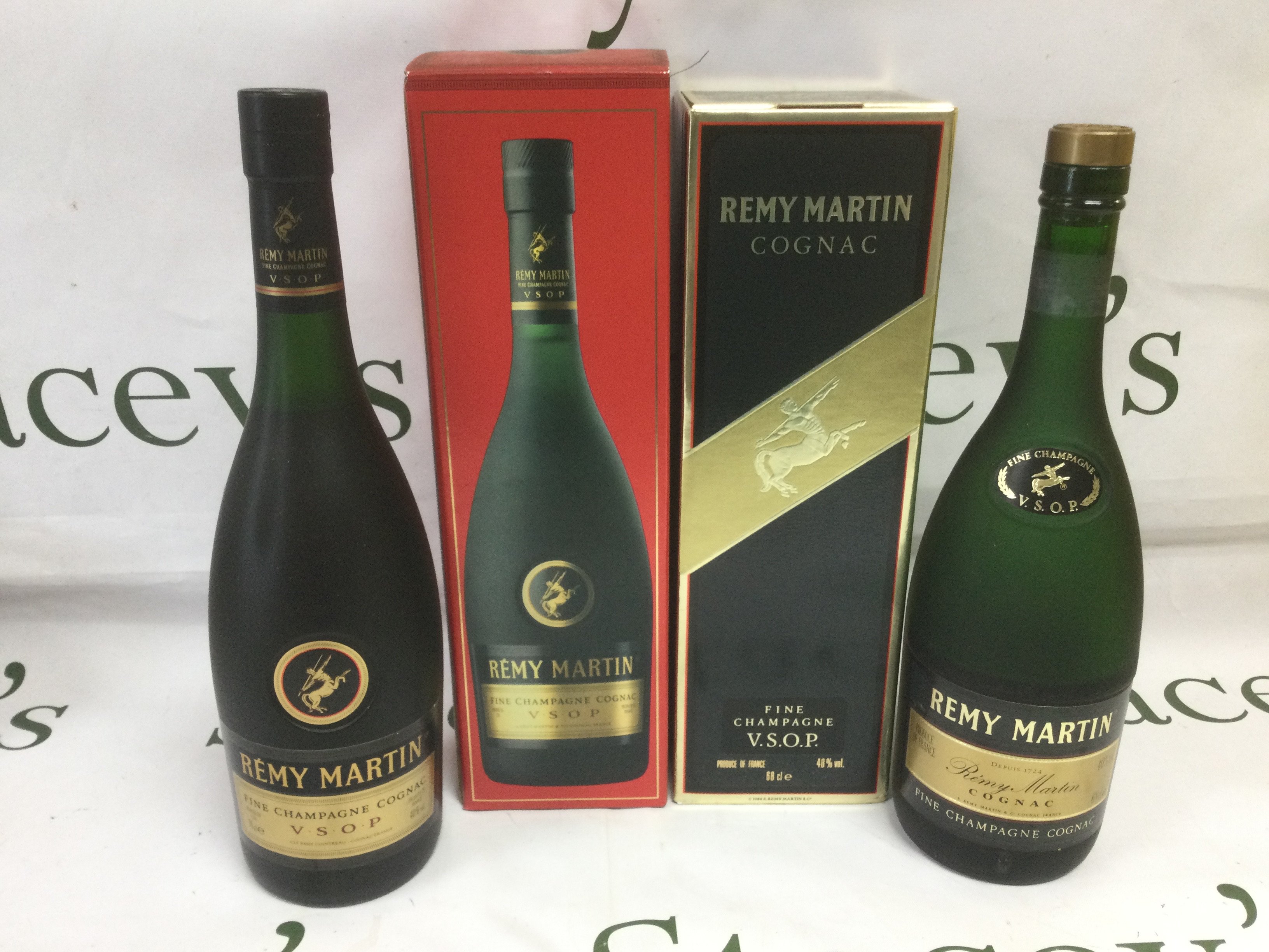 Two boxed Remy Martin cognac, one sealed and full, one opened. Shipping category D.