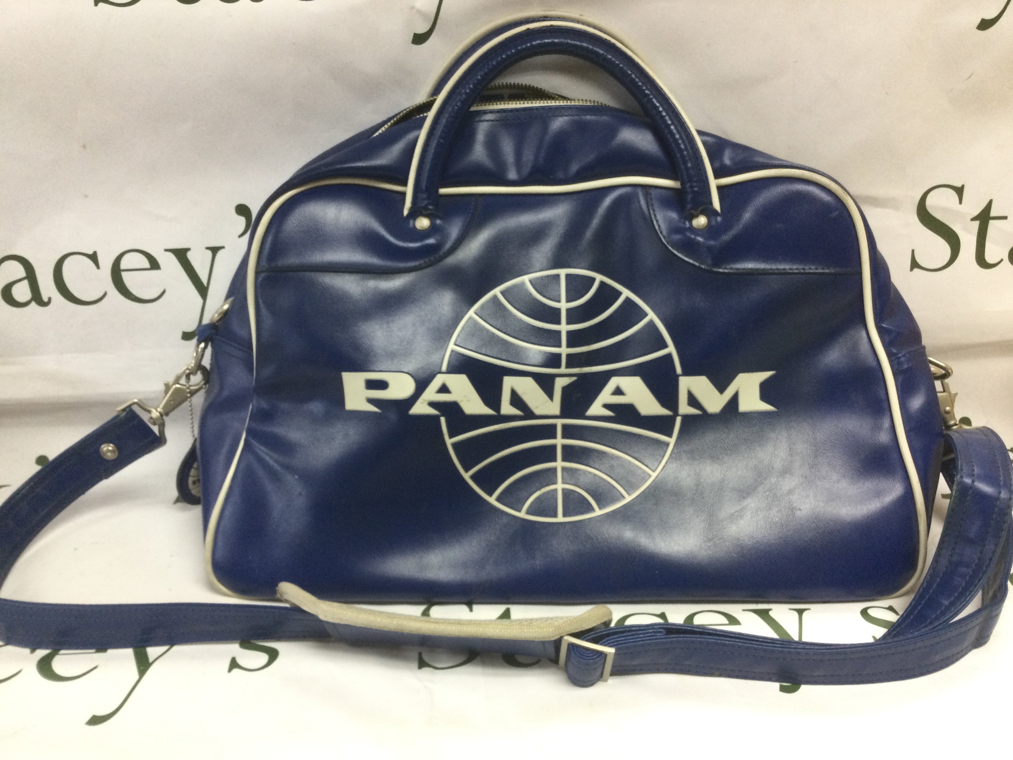 A vintage Pam Am shoulder bag and inaugural flight commemorative glass. Shipping category B.