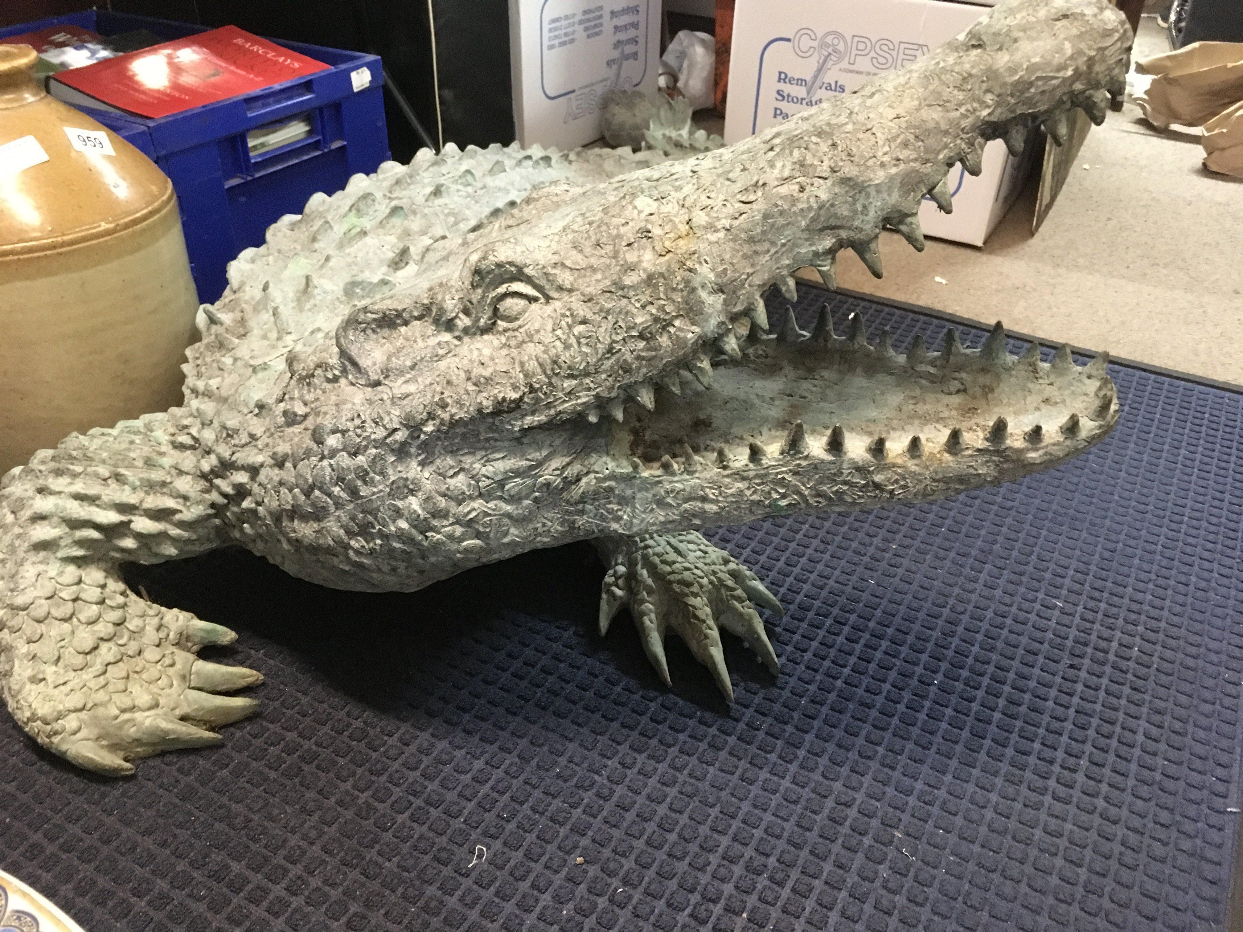 A large bronze water feature in the form of a crocodile .170 cm .