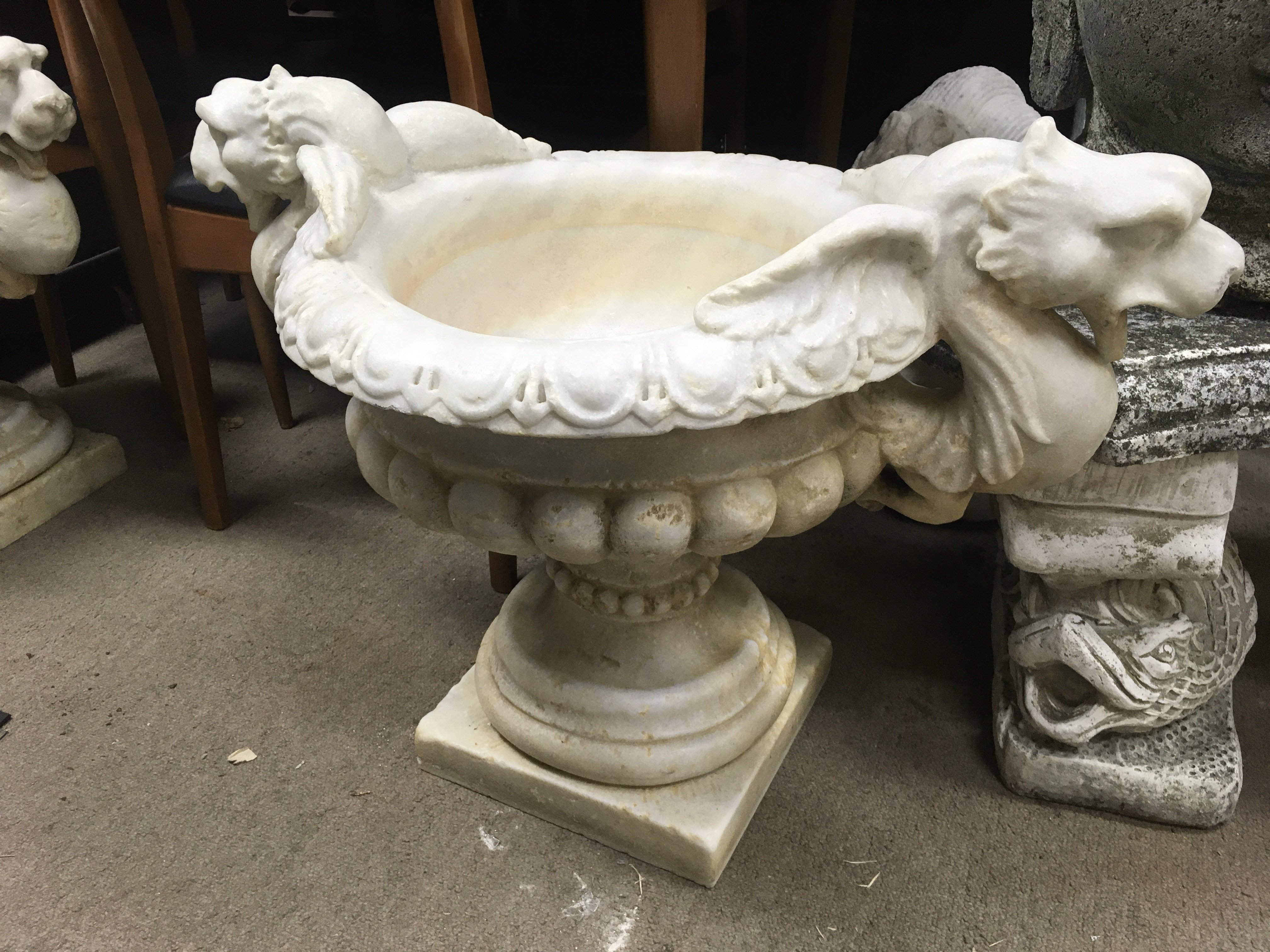 A pair of marble urns of classical style 46 cm .