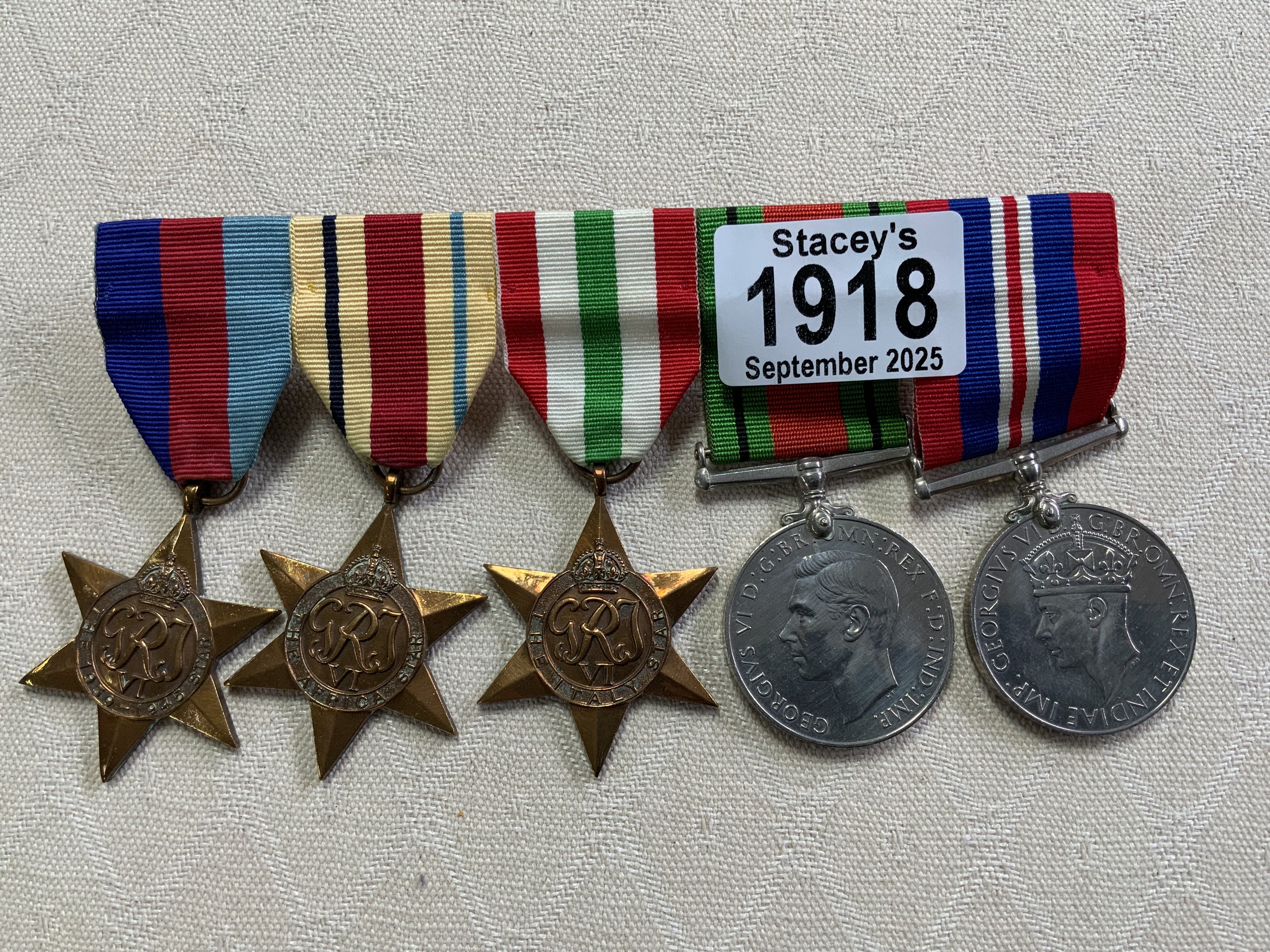 A Set of 5 WW2 military service medals. 39-45 Star/Africa Star/Italy Star/Defence medal/ 39-45 General service medal.