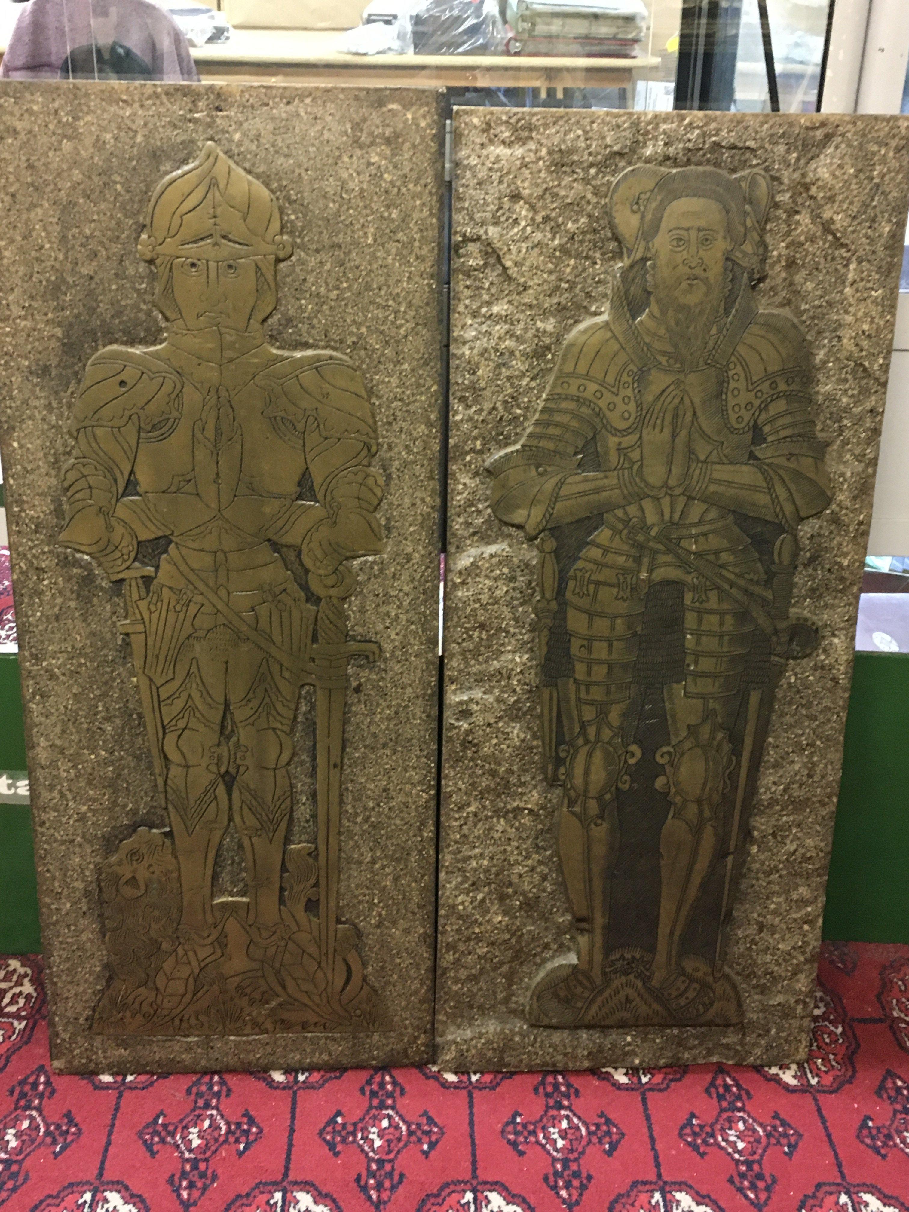 A pair of brass rubbing plaques
