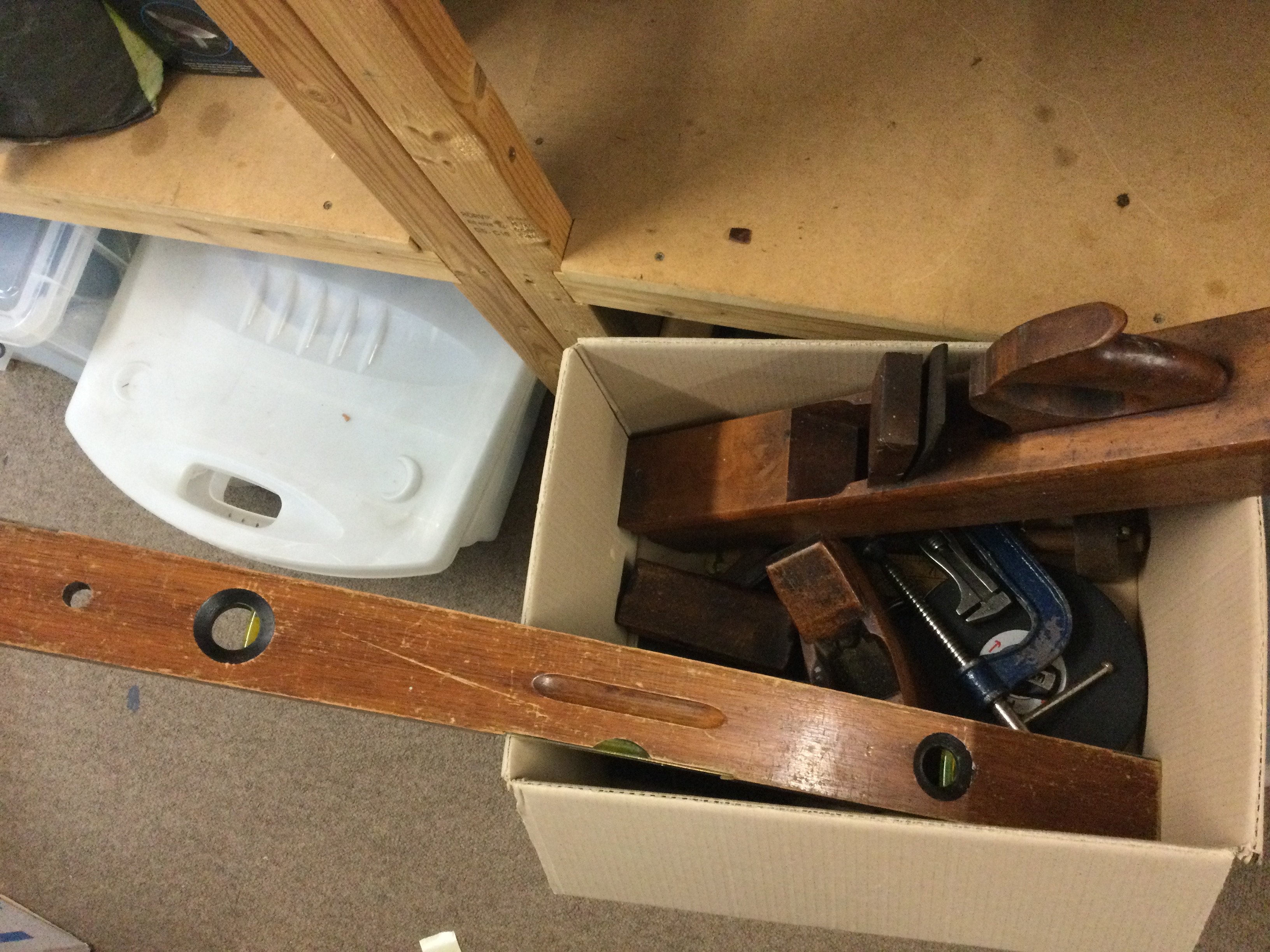 A collection of tools including wooden planes, Stanley steel plane, etc