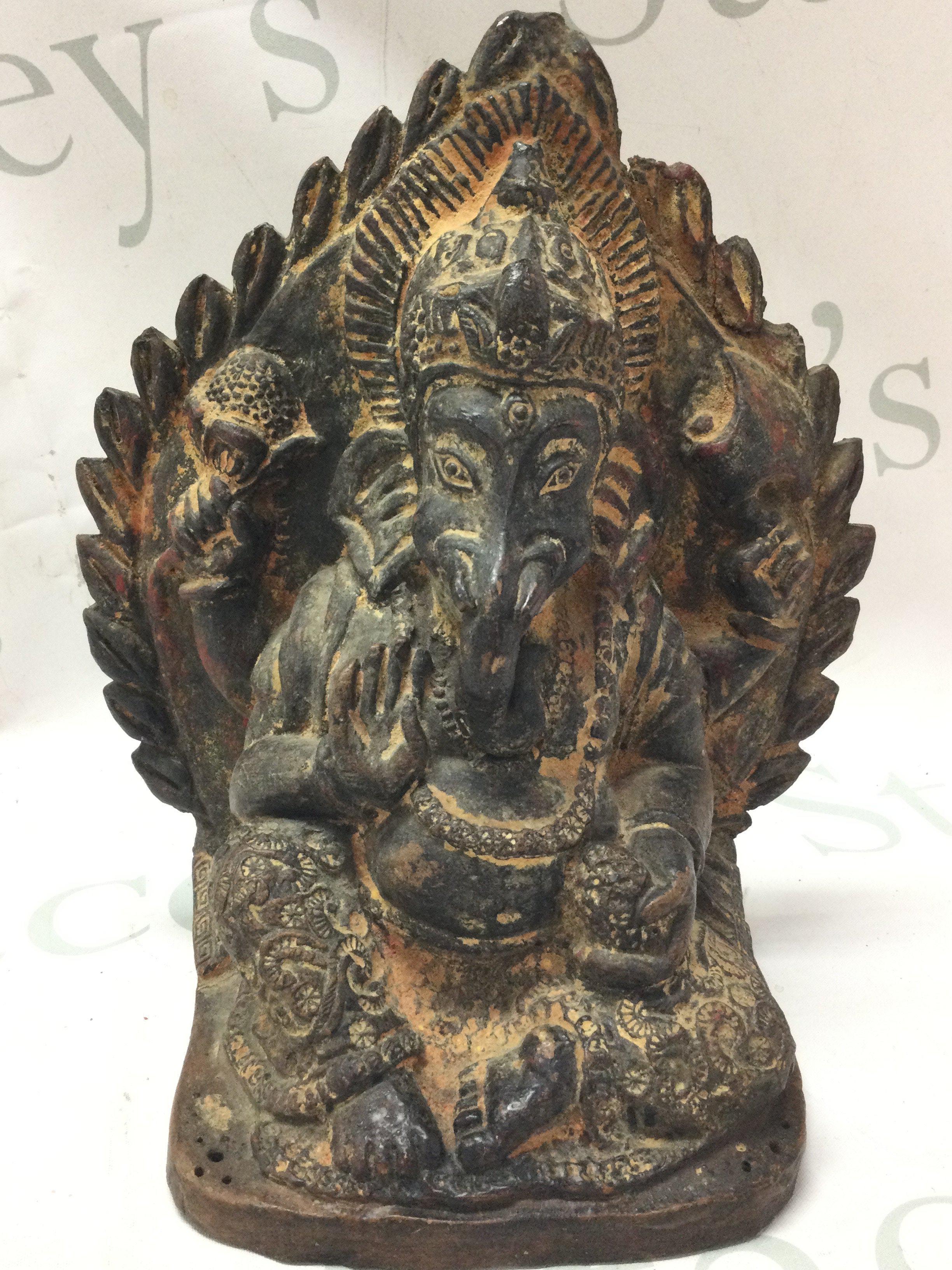 A clay pottery figure of Ganesh , 24cm tall. postage cat C