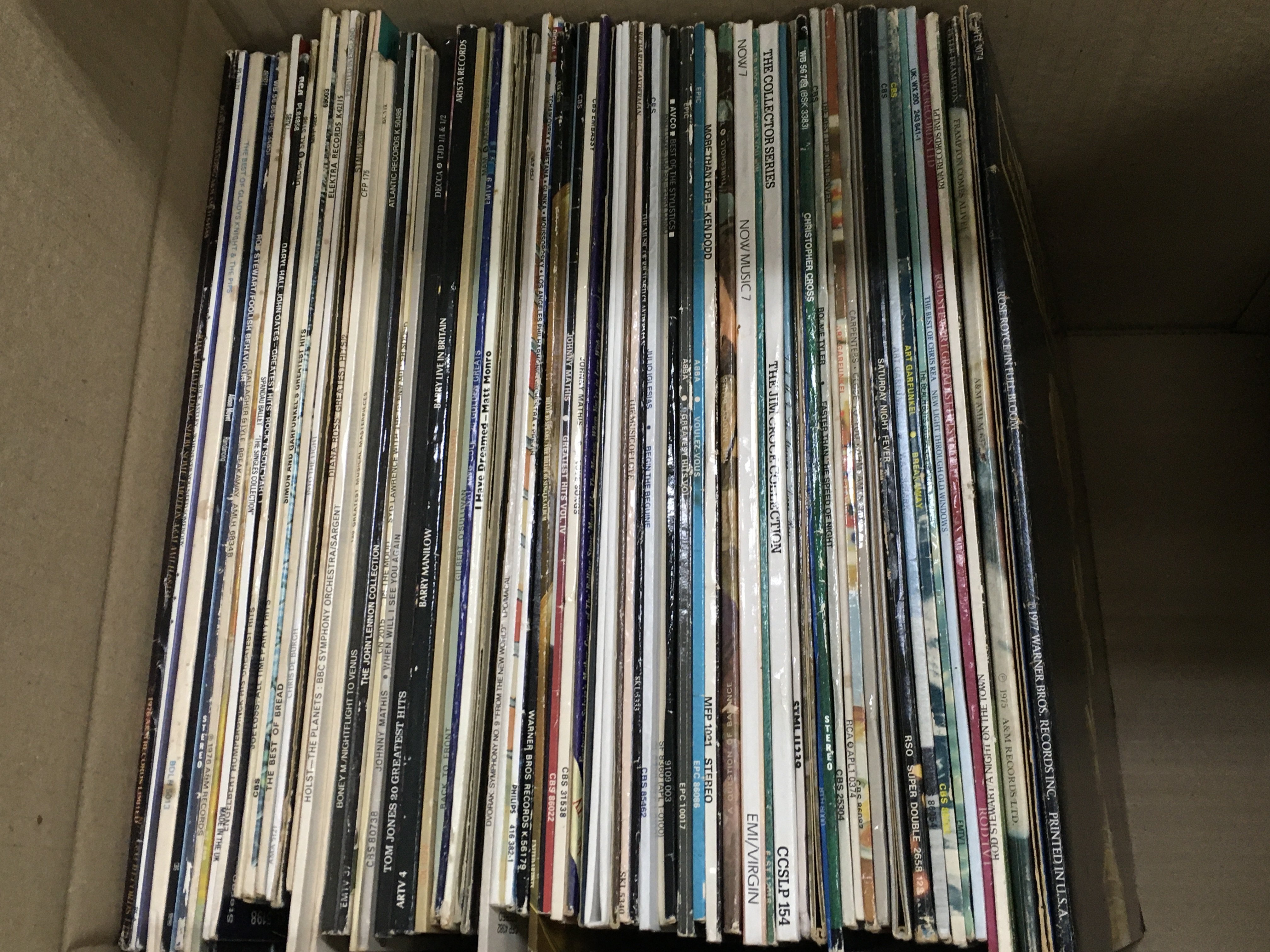 A collection of vinyl records including ABBA, Rod Stewart, Peter Frampton etc