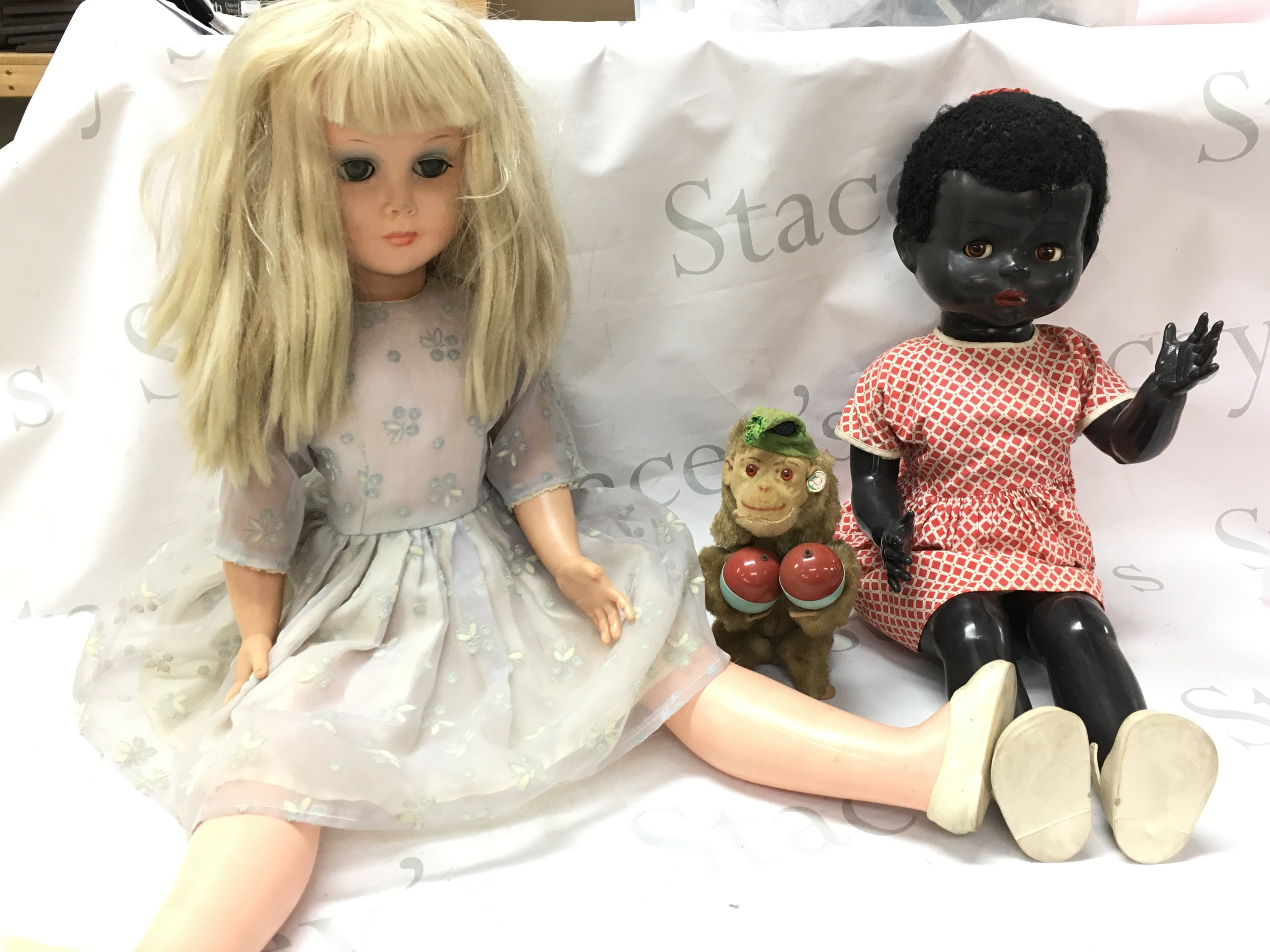 Two vintage dolls Pedigree & Semco and a German clockwork monkey . This lot cannot be posted