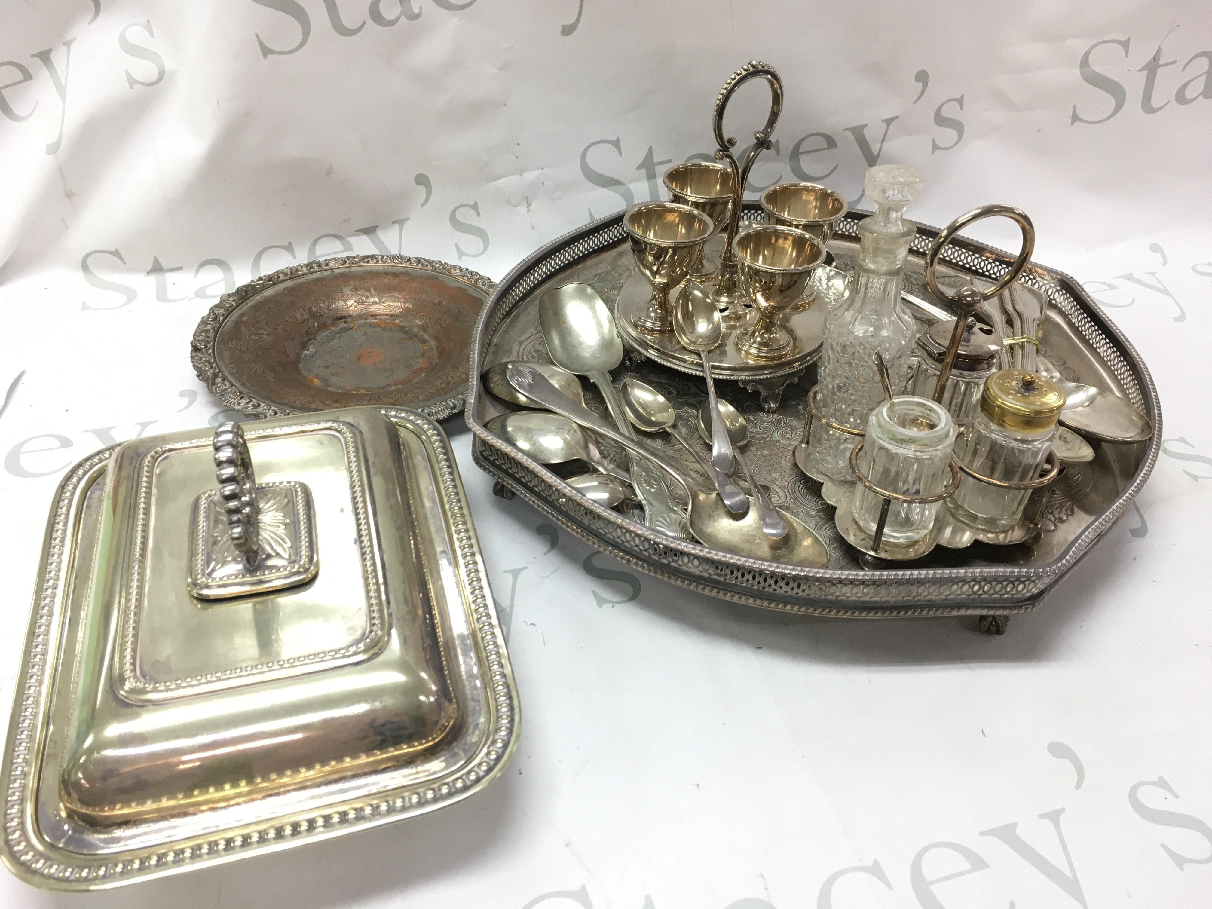 A collection of silver plated items including cutlery, a tray , cut glass condiment jars etc. this lot cannot be posted
