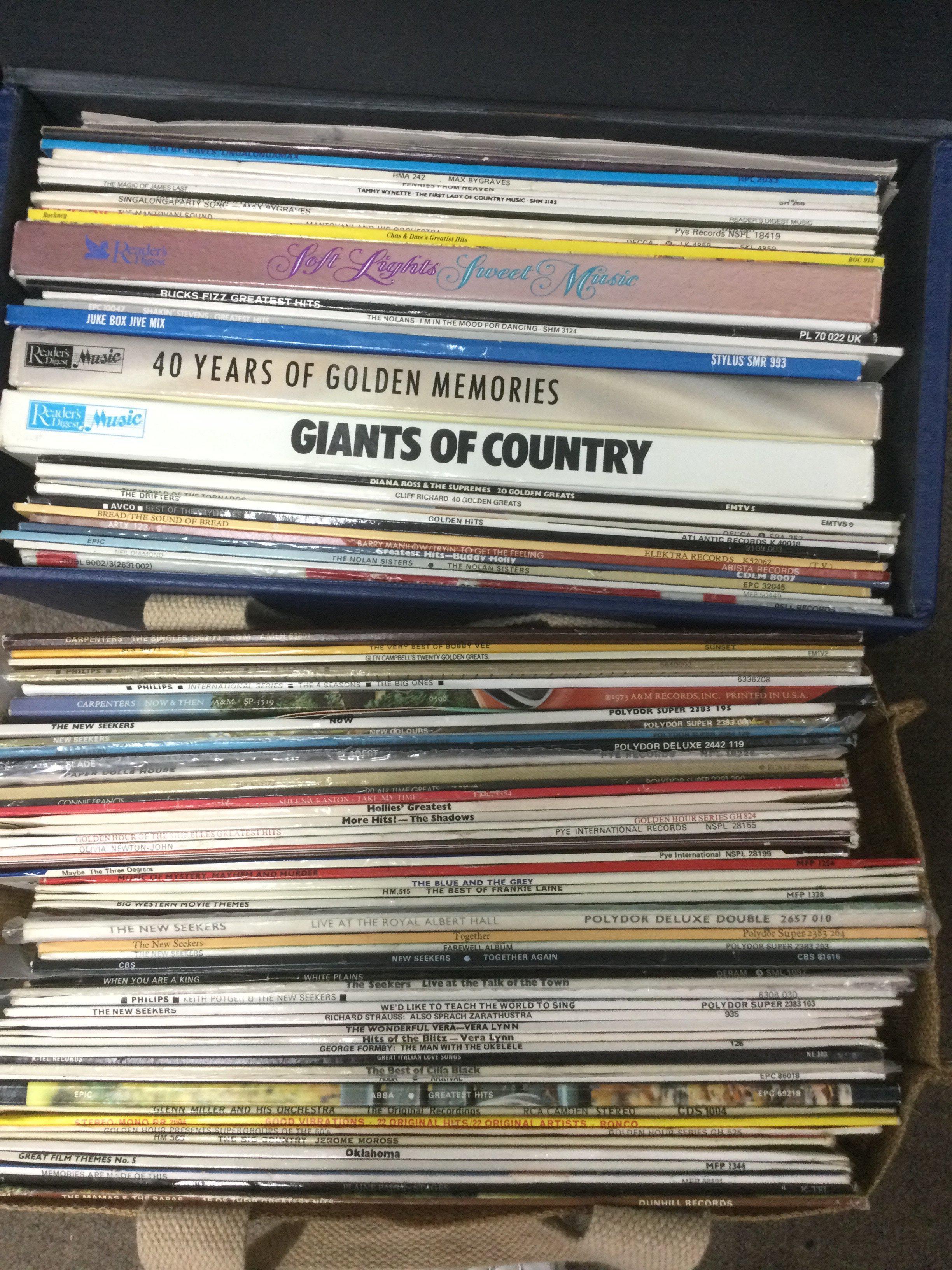 A record case and a bag of LPs by various artists including The Shadows, Abba and others. Shipping category D.