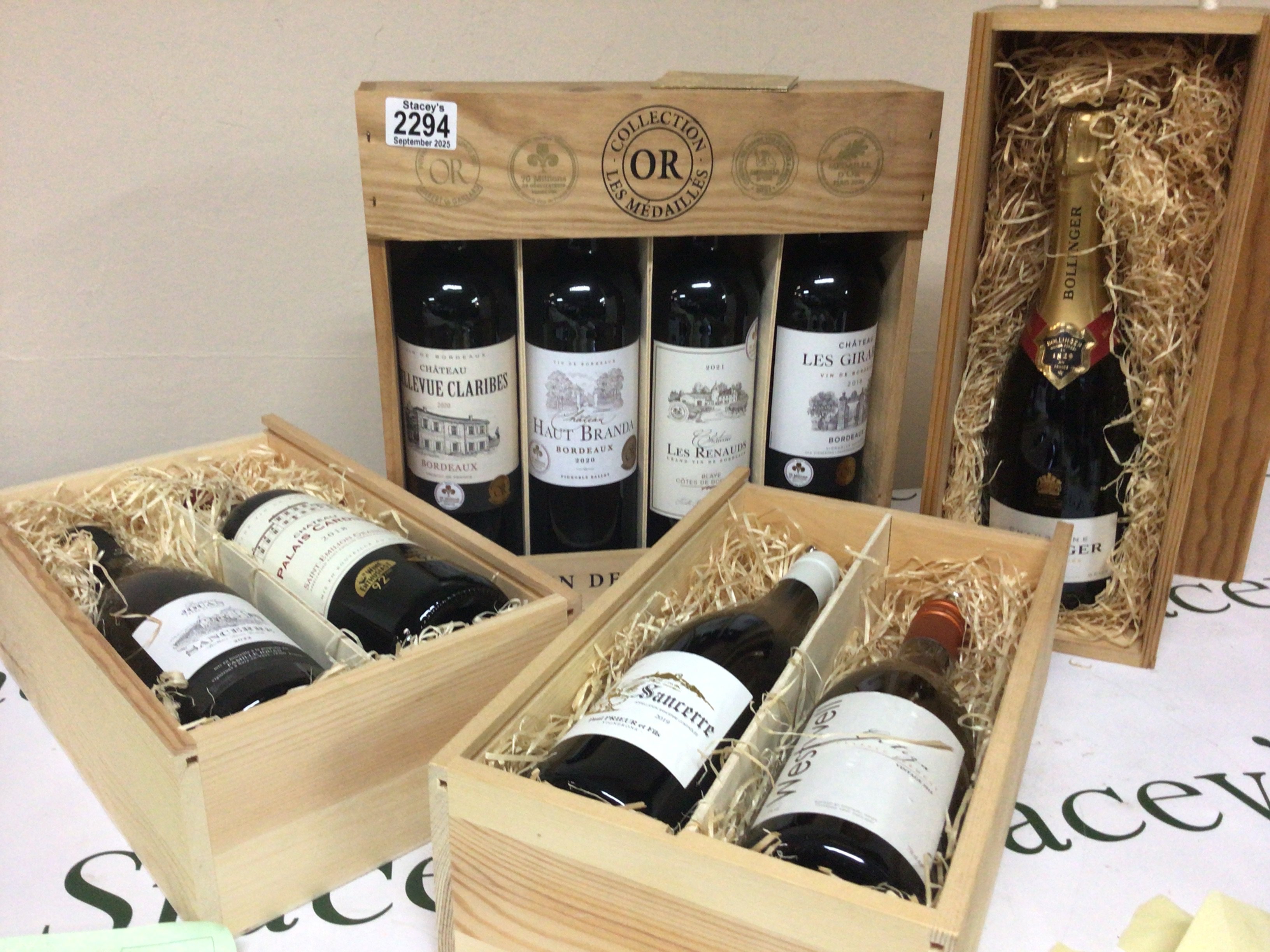 A collection of quality Vintage wines from the Bordeaux region and Saint-Emilio. some grand cru a bottle of Bollinger Champagne all well presented in wooden cases.