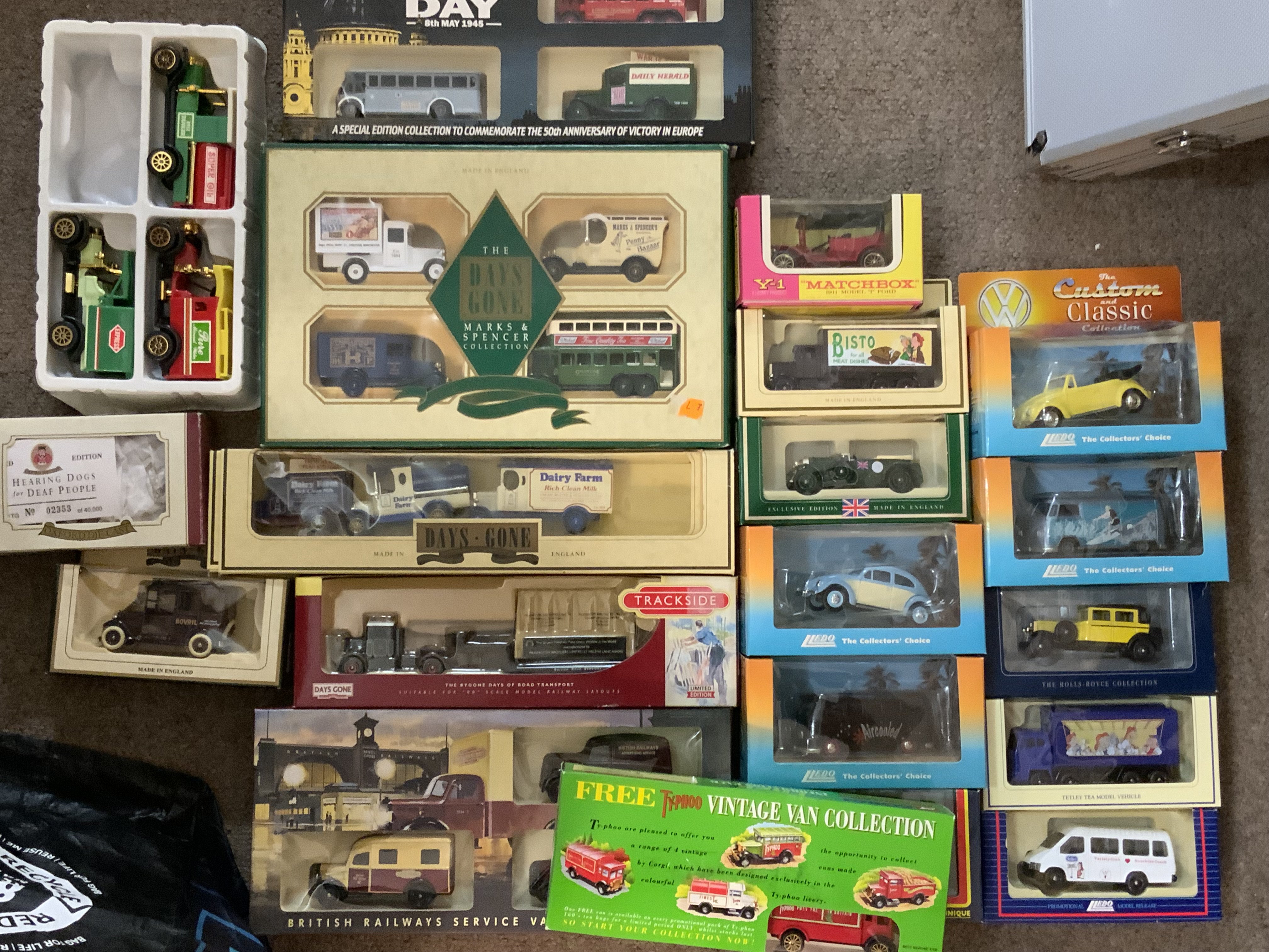 A collection of boxed Diecast toy cars.