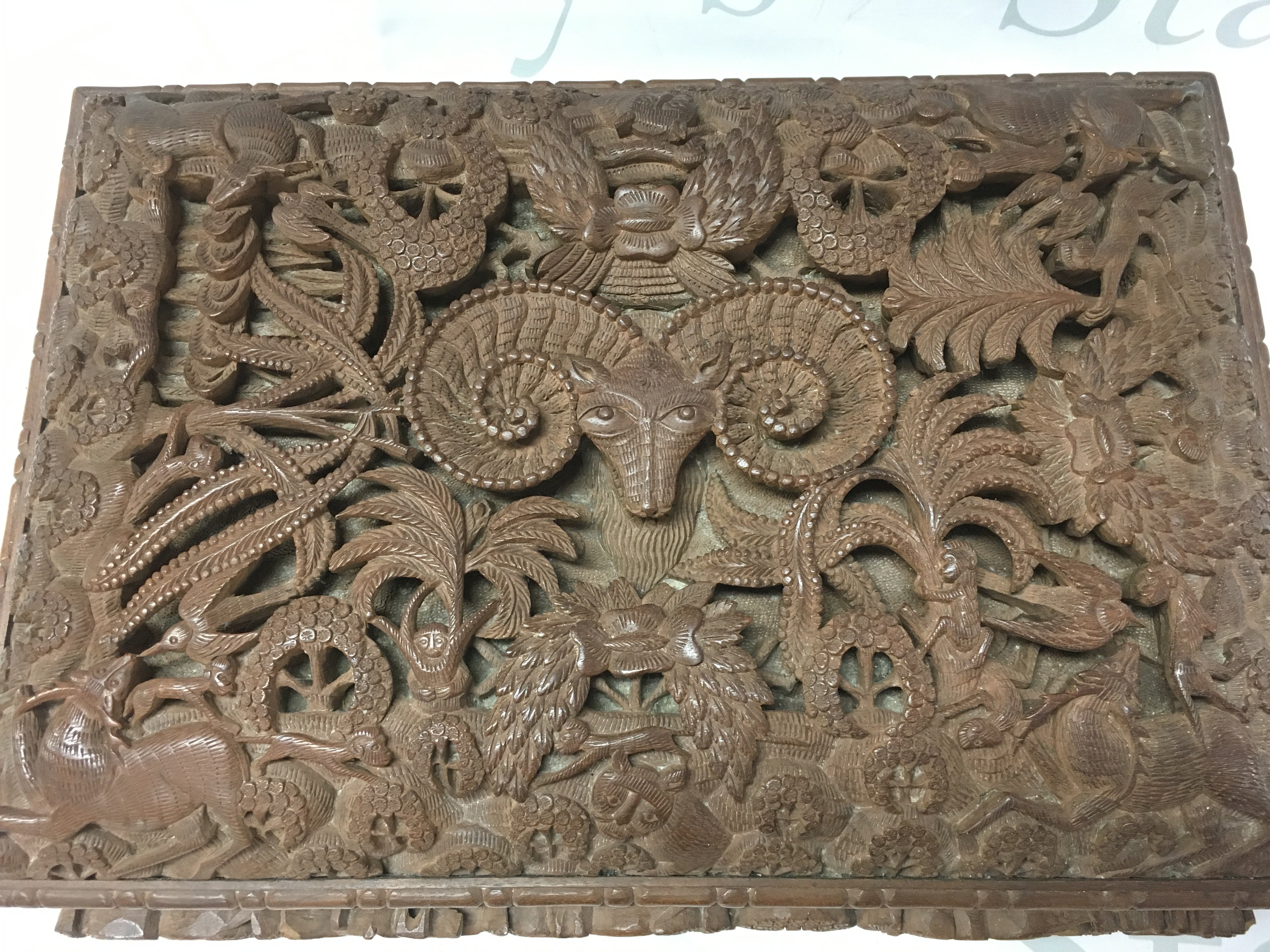 Anglo Indian Hardwood possibly walnut box with intricately carved animal decoration. Dimensions 24x34x13cmcm. Postage category C