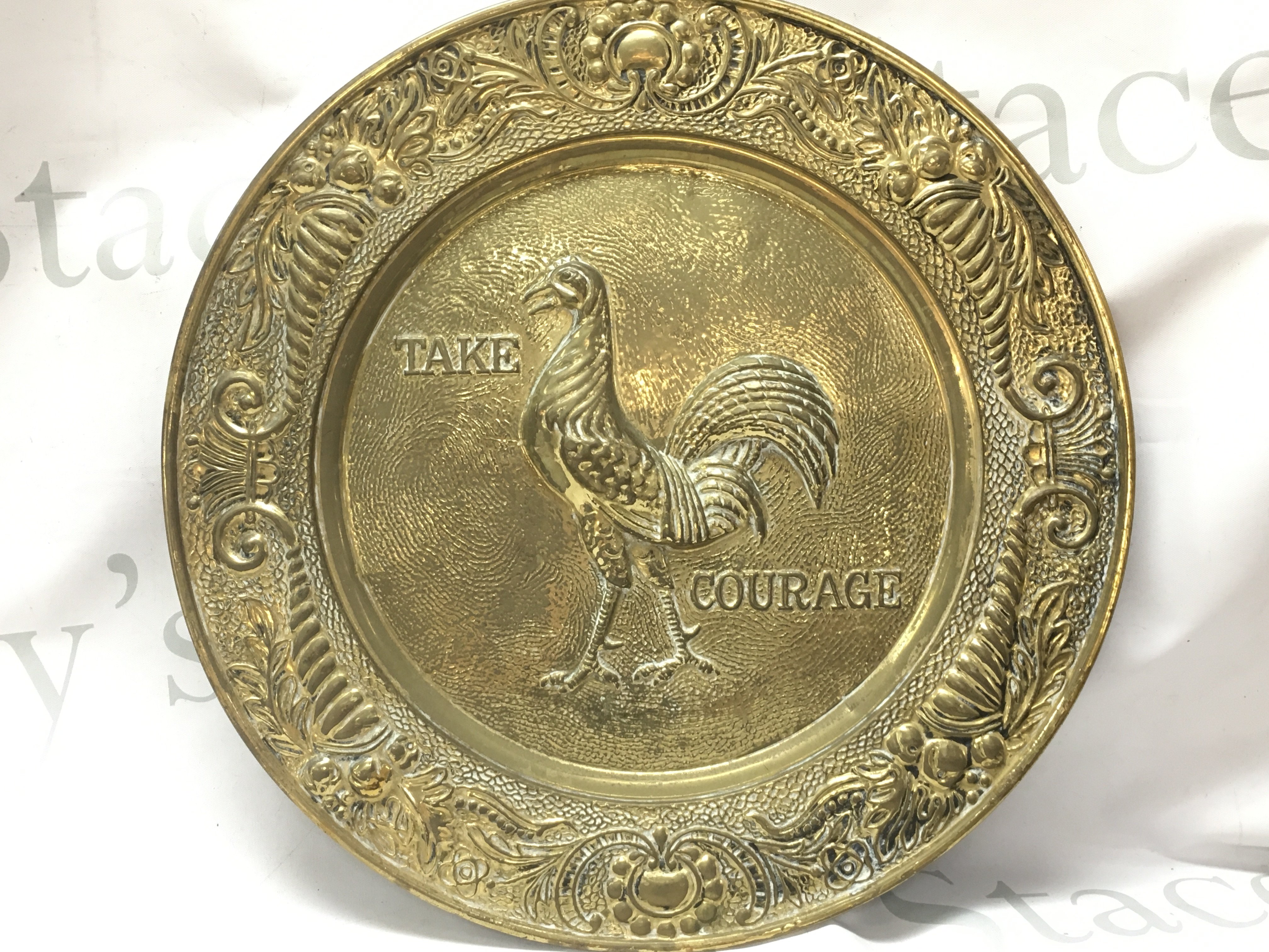 A vintage brass take courage embossed tray , 36cm wide. postage catB