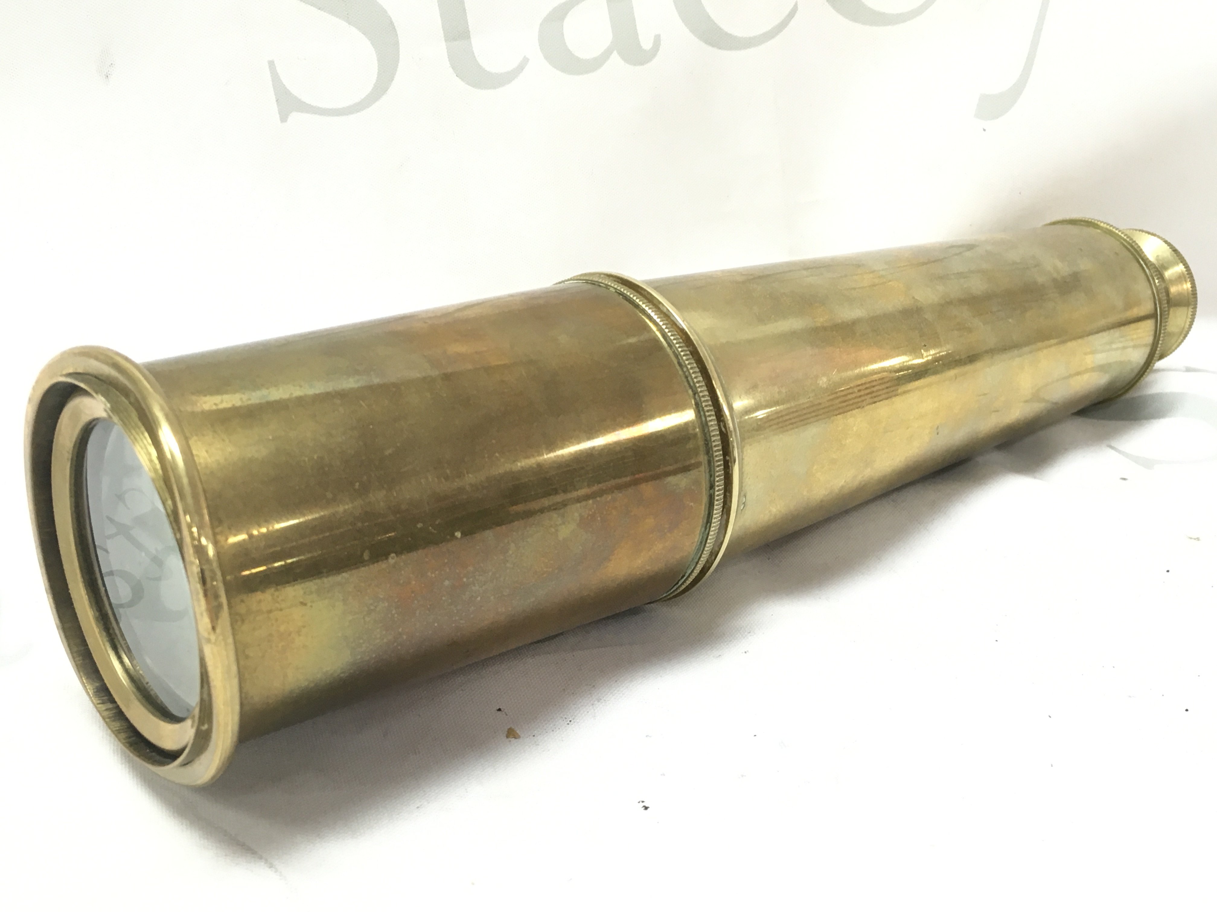 A brass three draw telescope by T.Cook London 1842, 85cm total length fully extended .
