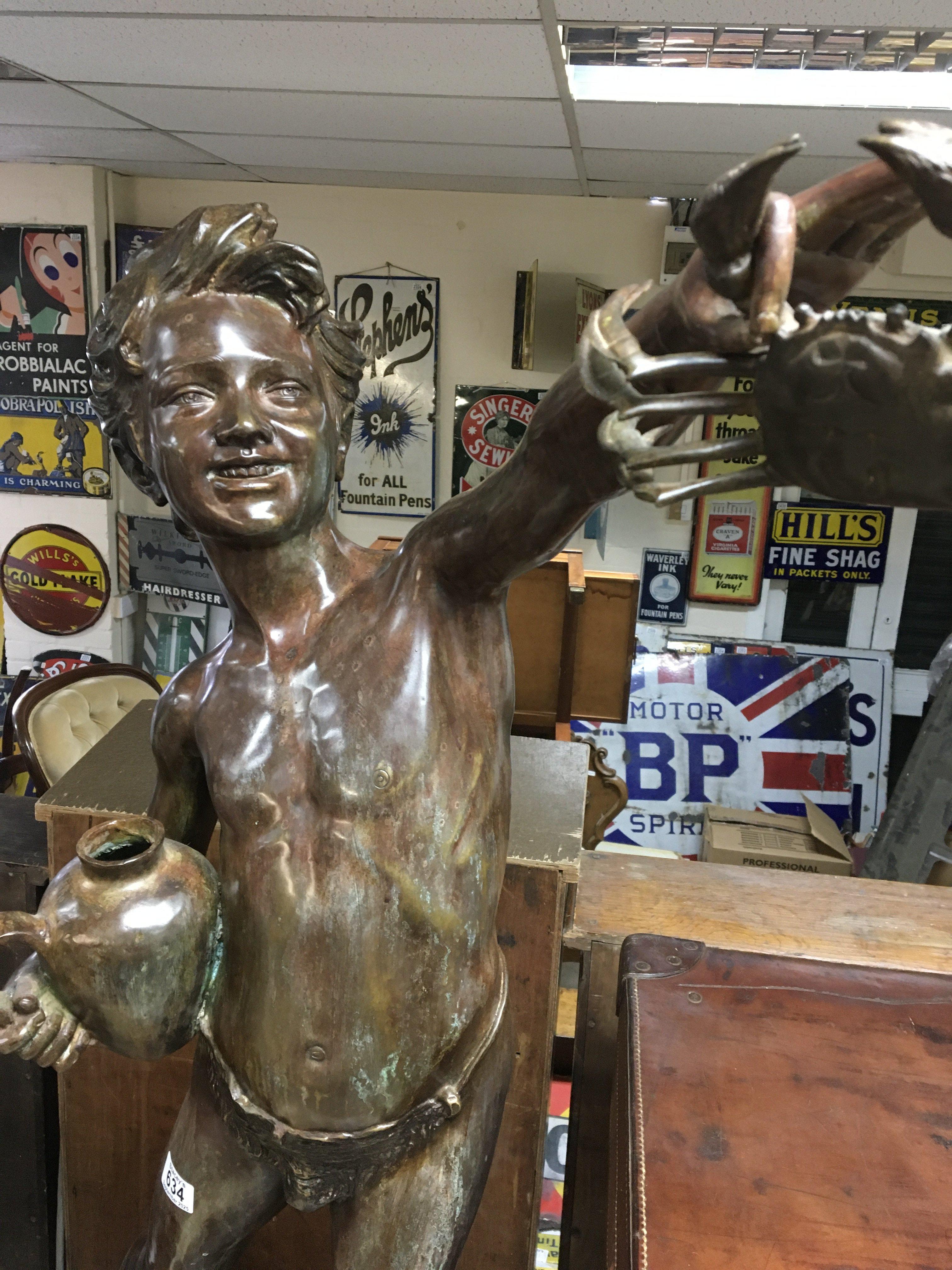 A large bronze in the manor of Giovanni De Martino figure of a boy holding a crab 115 cm .