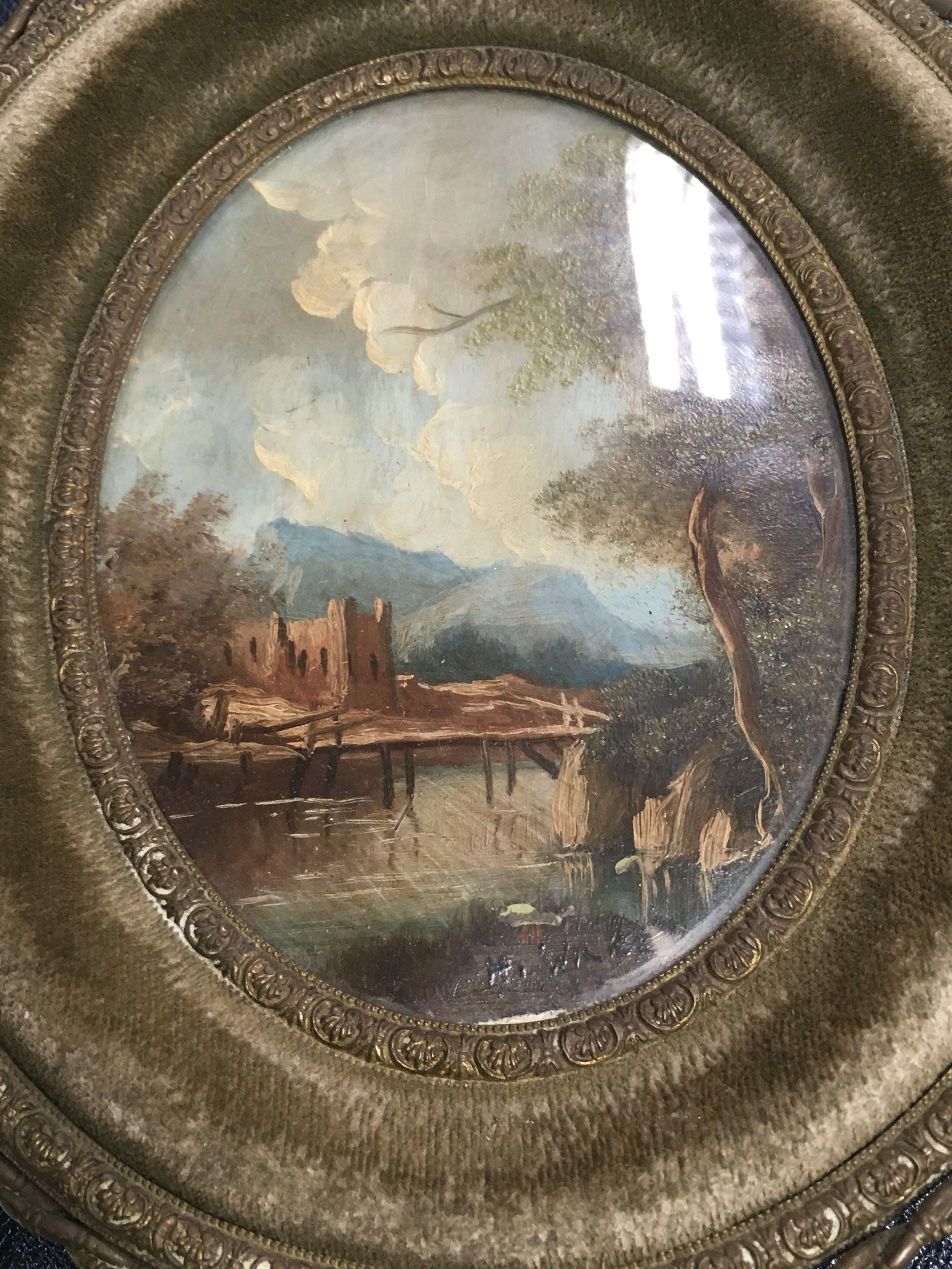 A framed pair of oval Continental oil painting land scape view .