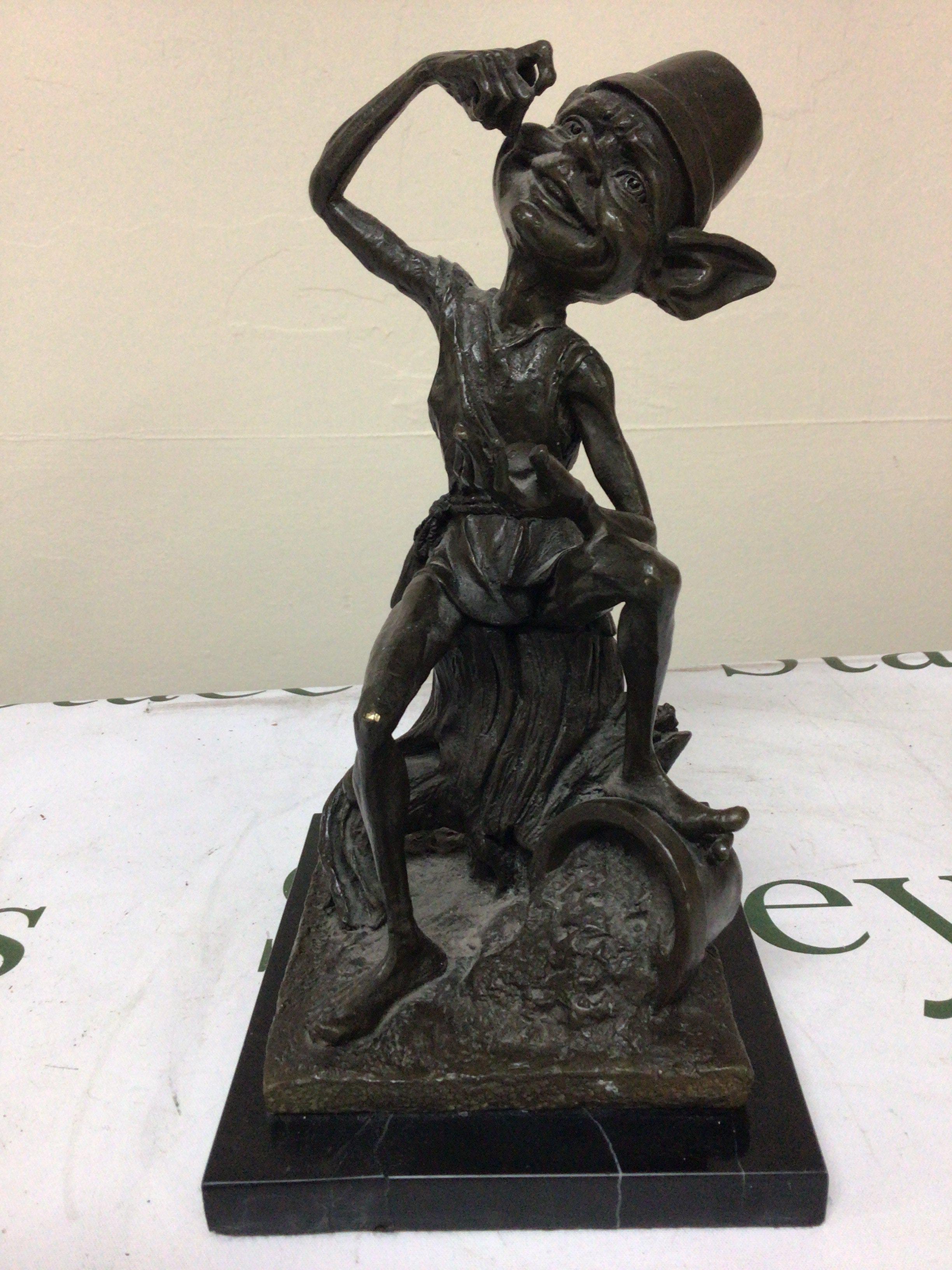 A 20th Century bronze figure of a Hoblin seated on a tree trunk with a marble base attributed to Julian Jeffery (b1973) Height 26cm.