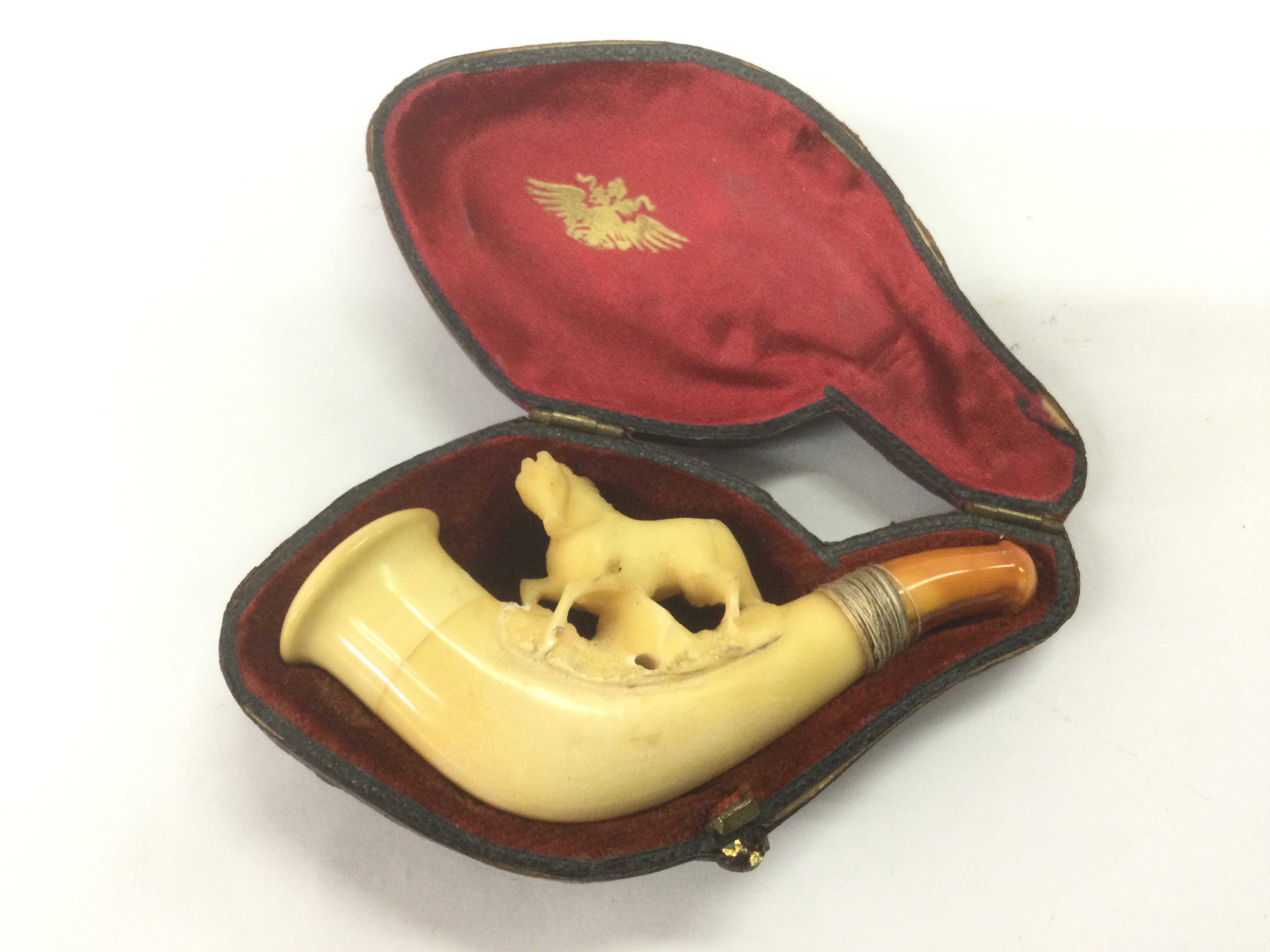 A cased Meerschaum pipe surmounted with the figure of a horse. Shipping category A.