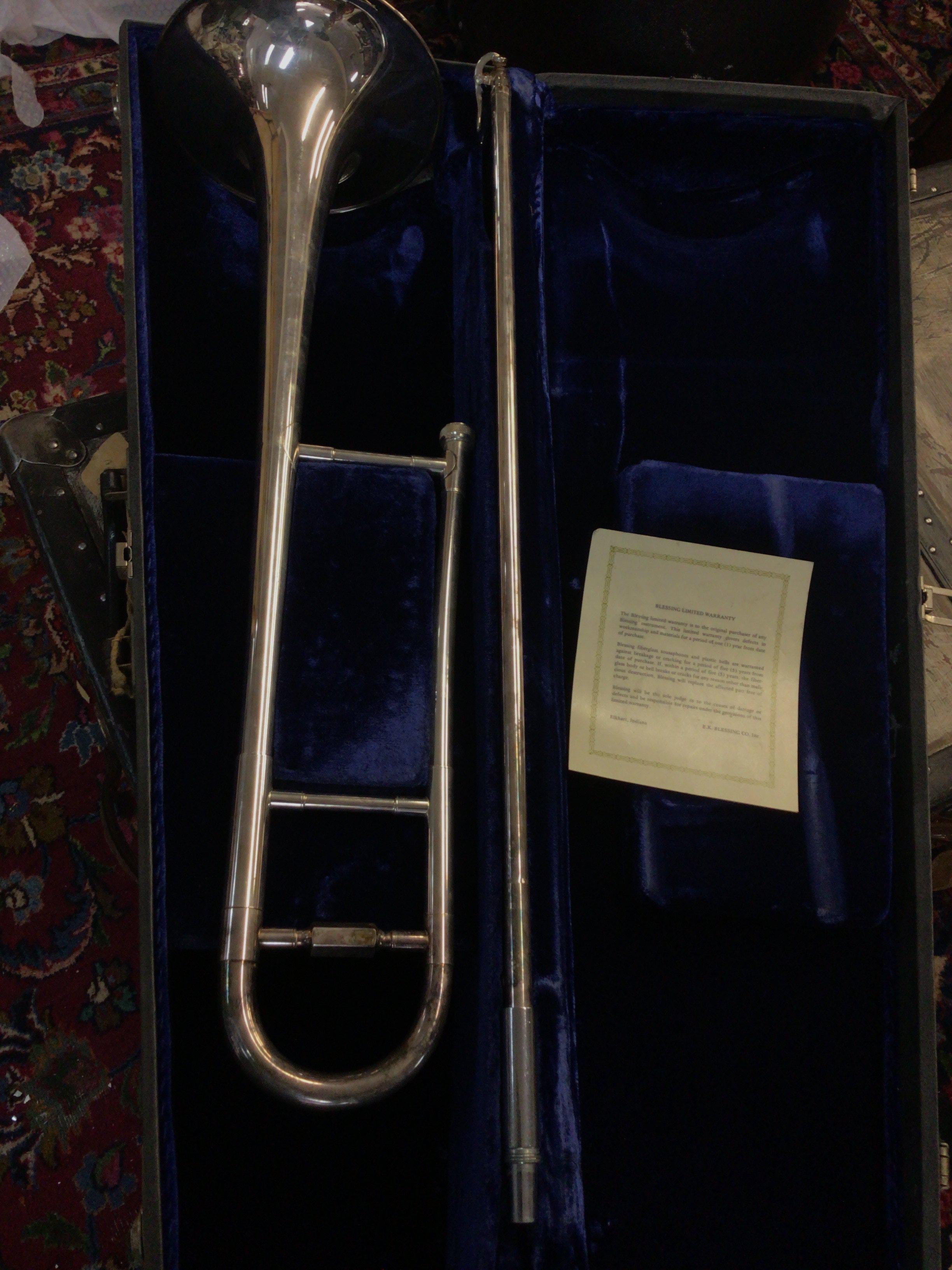 An American Chrome finished Blessing & Co trumpet in a fitted case with Warranty card.