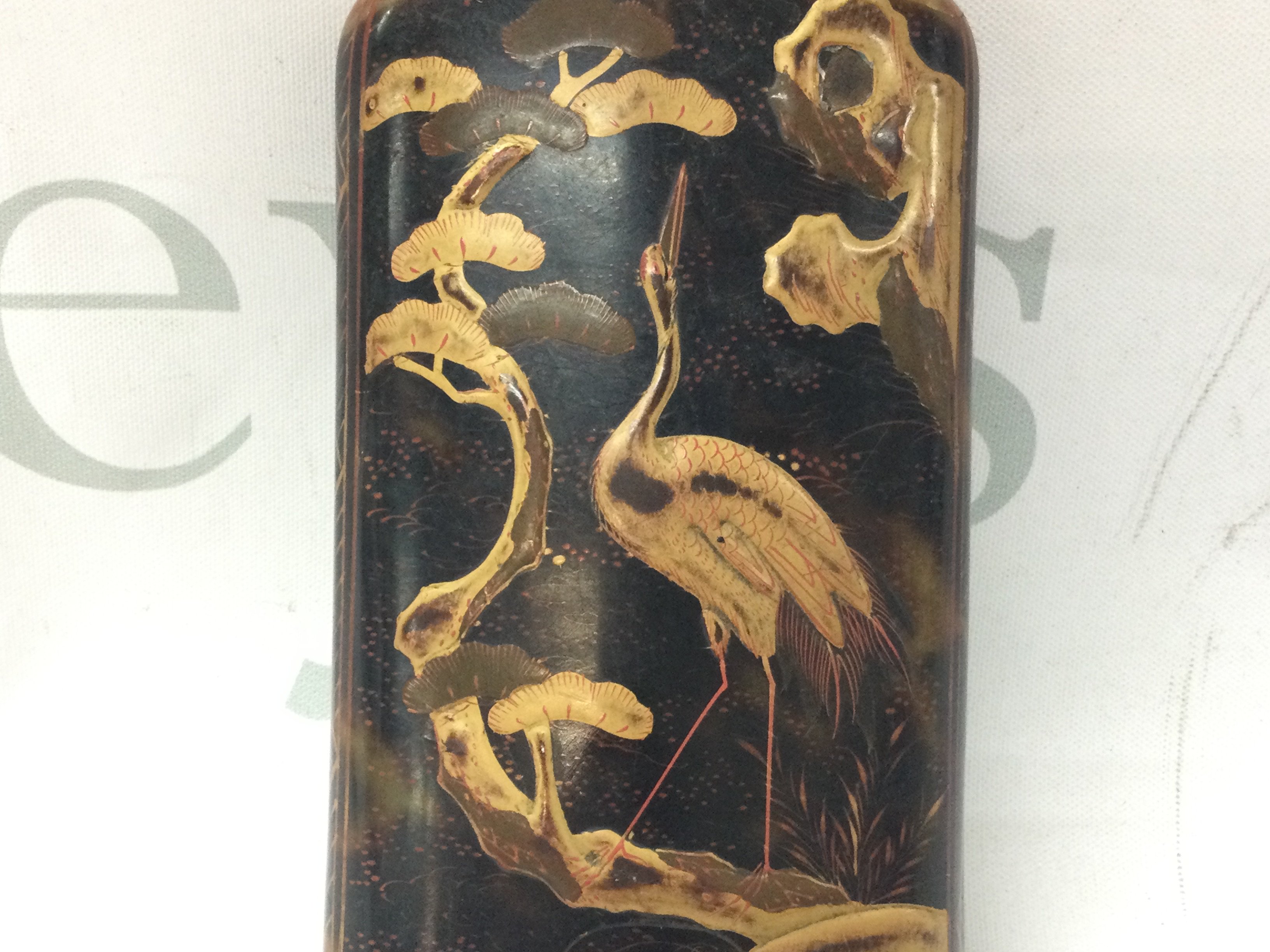 A Japanese tortoiseshell cigar case with embossed decorated giltwork and orient animal design. 12cm tall. Postage category B