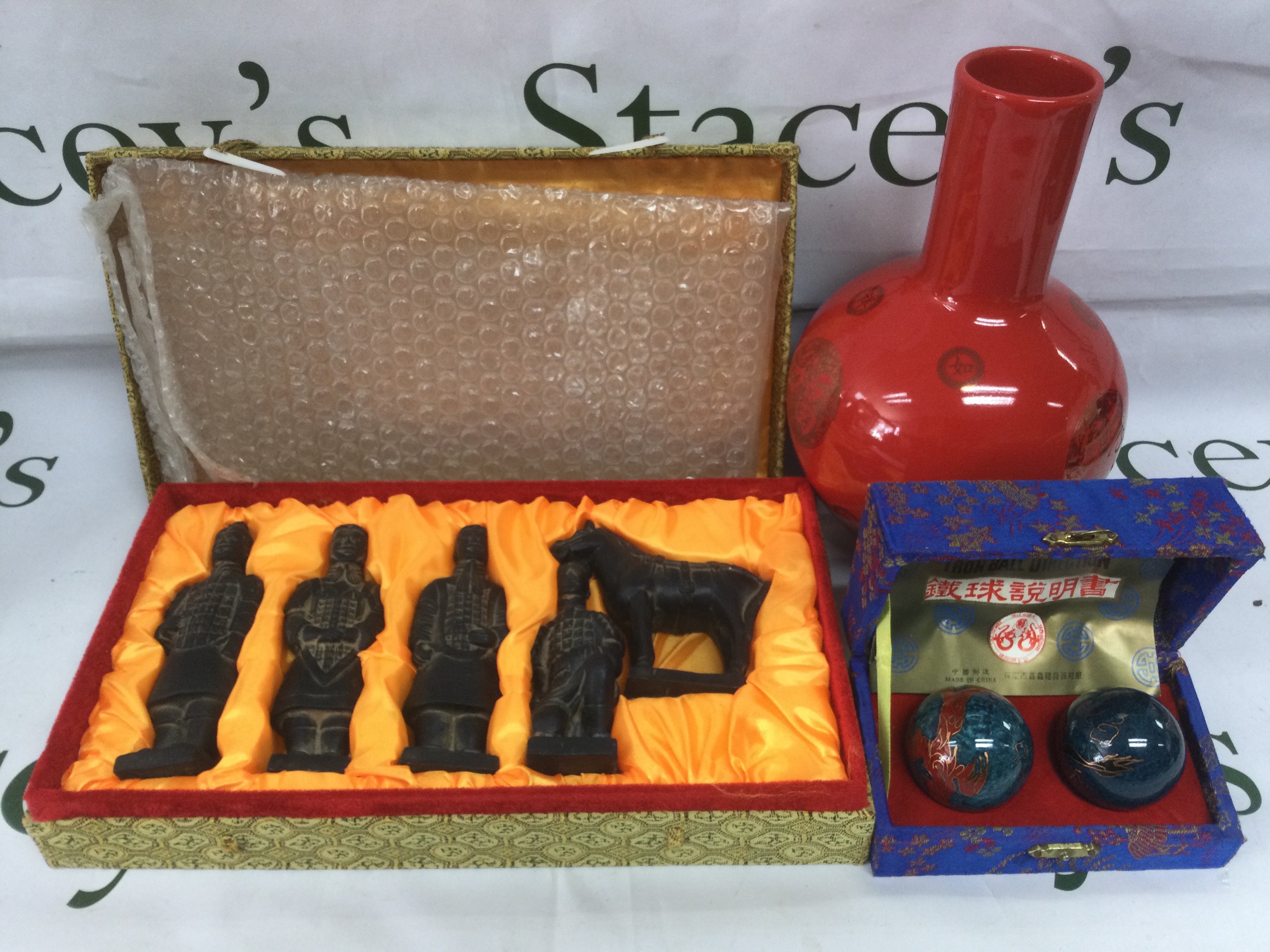 A collection of modern Oriental ornaments including a puzzle ball, vase etc. Shipping category D.