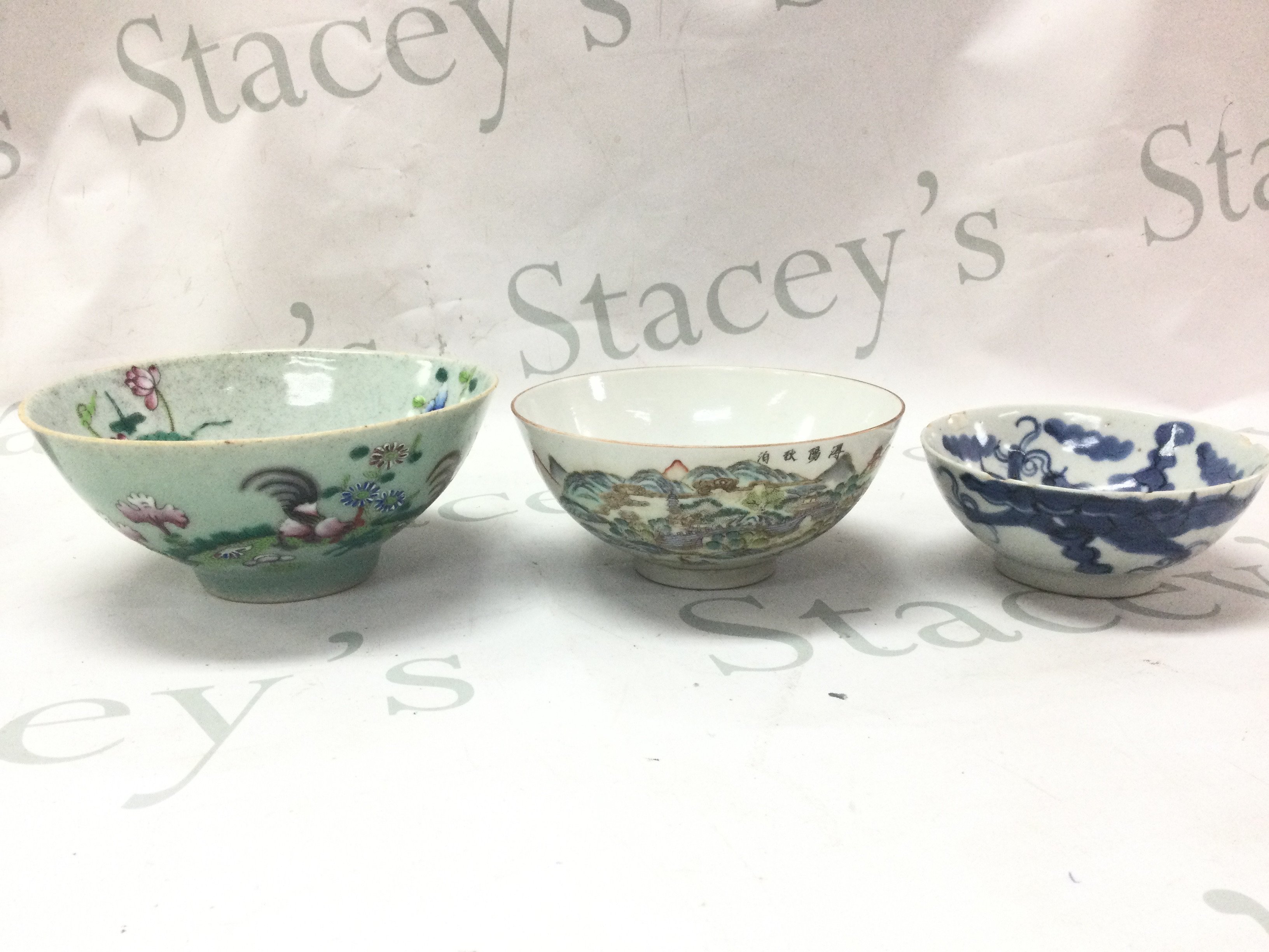 Three Chinese porcelain bowls including a Famille Rose Animal dish, Famille Rose landscape bowl and a blue and white bowl (chips seen) .12,15,16cm wide . This lot cannot be posted