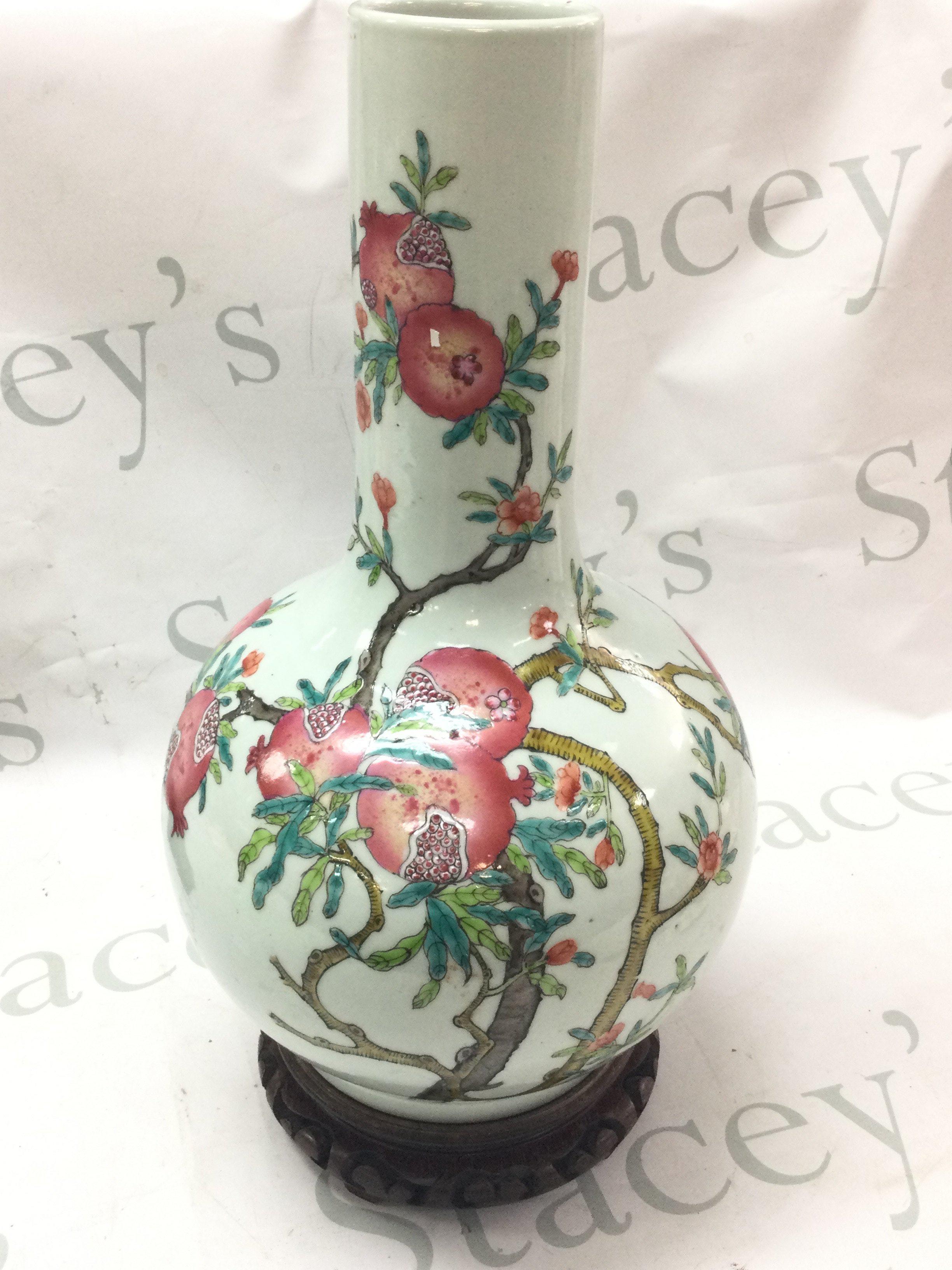 A Chinese Famille Rose Pomegranate vase 39cm tall. Some flaws in the glaze but no obvious damage or restoration.This lot cannot be posted