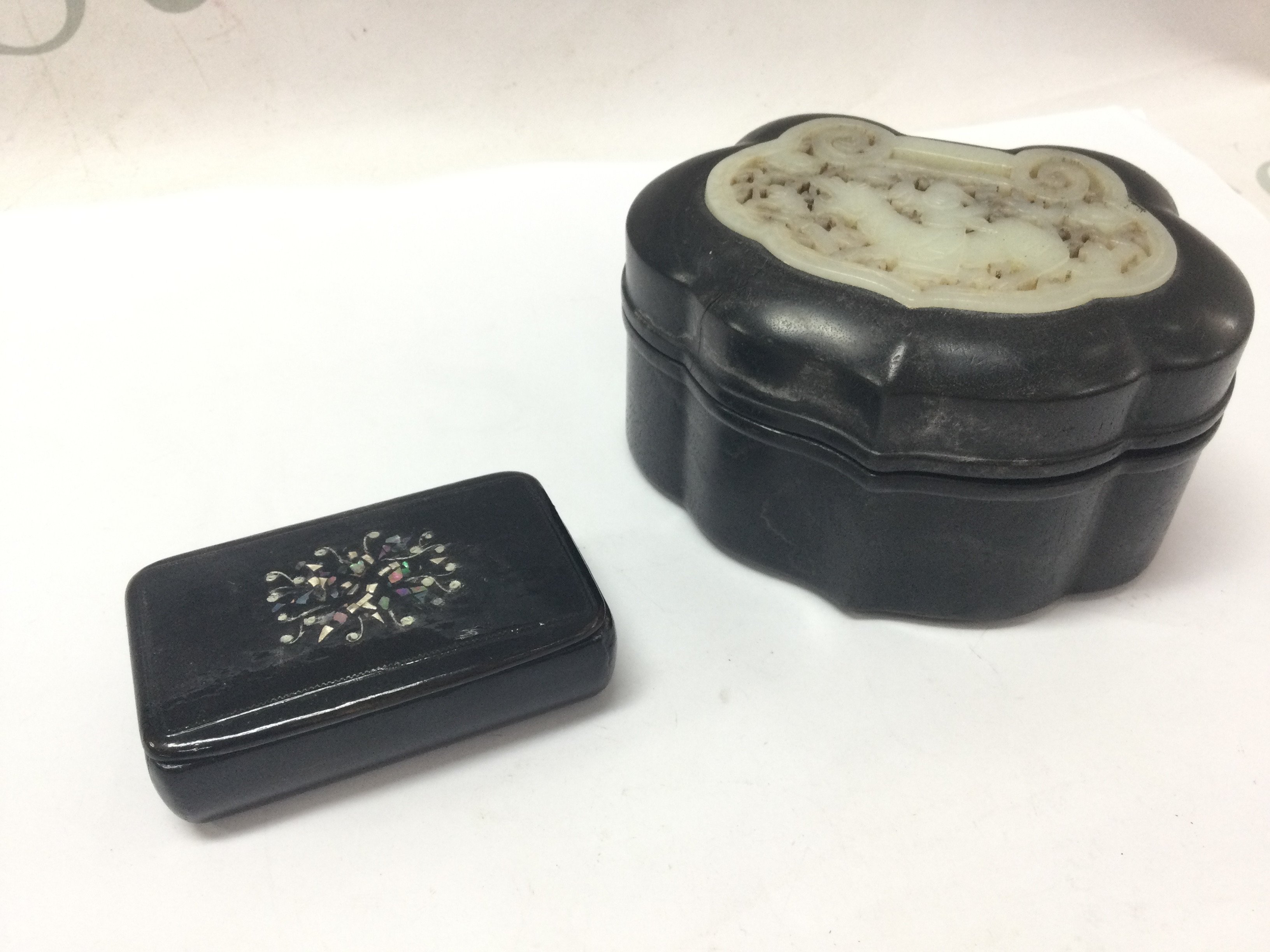 A Chinese ebony wood jade inset trinket box and a paper mache snuff box with two small stamp seals