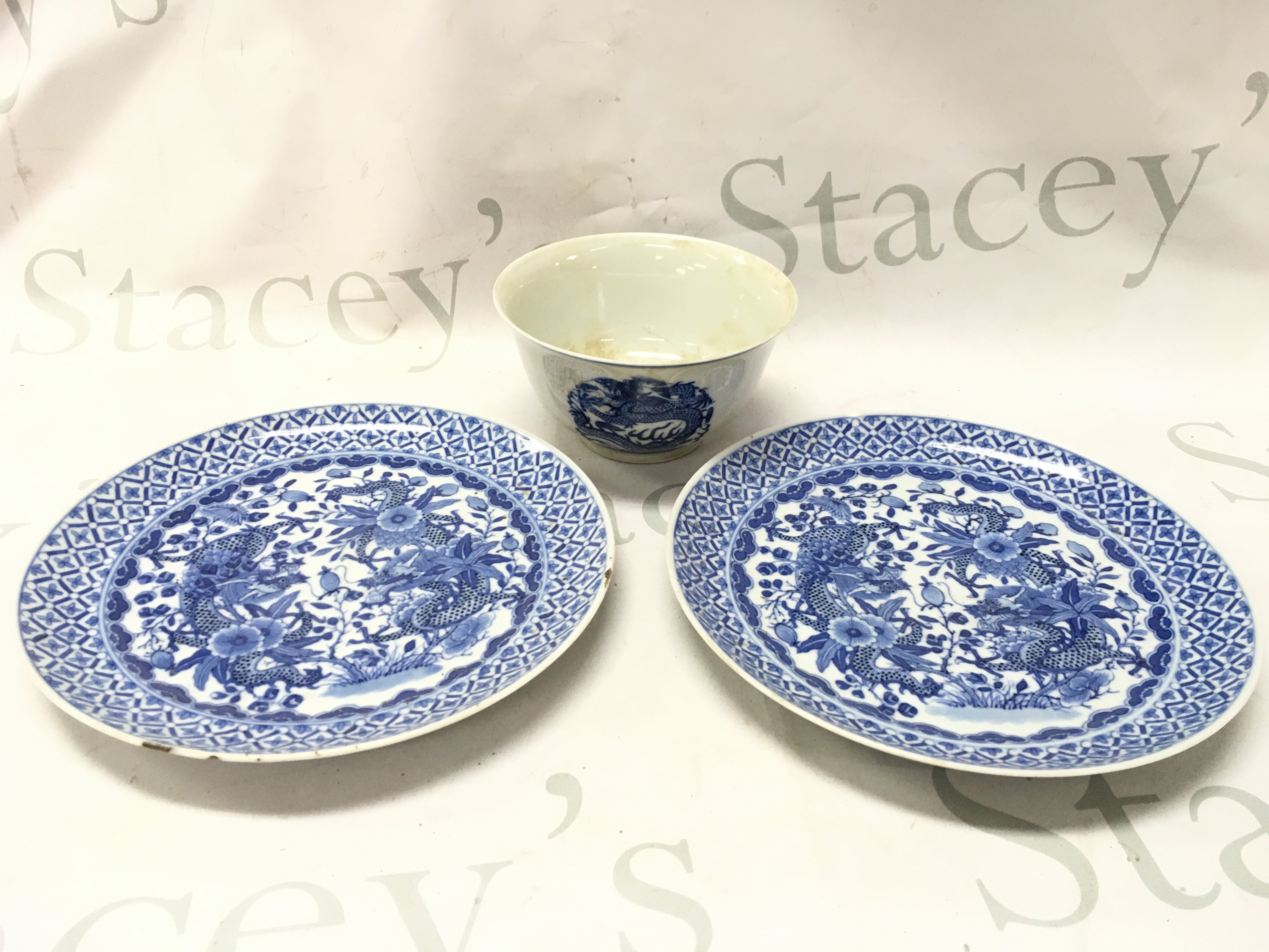 19th century export Chinese blue and white dragon bowl (with six character marks at the base) and two plates (chips and hairline cracks seen) . This lot cannot be posted