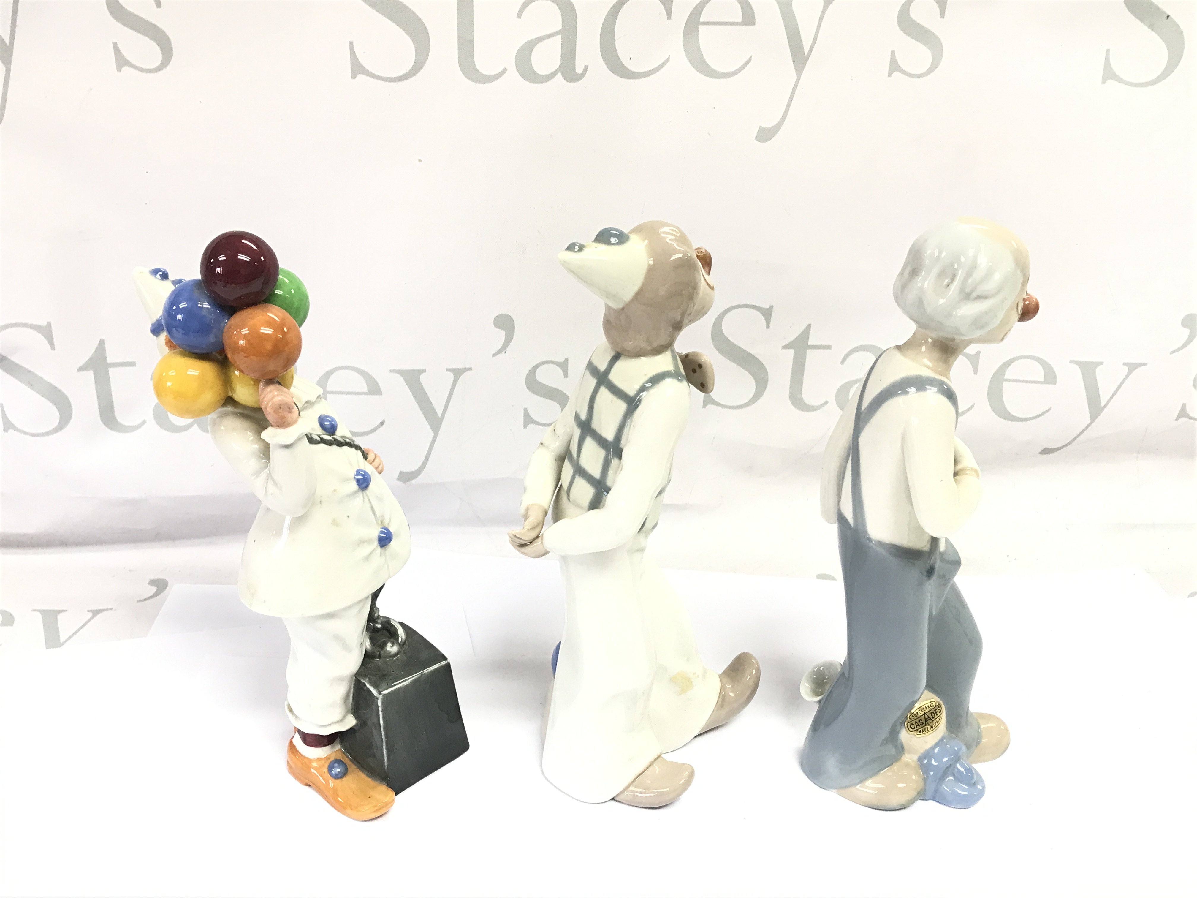 A Doulton clown and two other clowns.- NO RESERVE