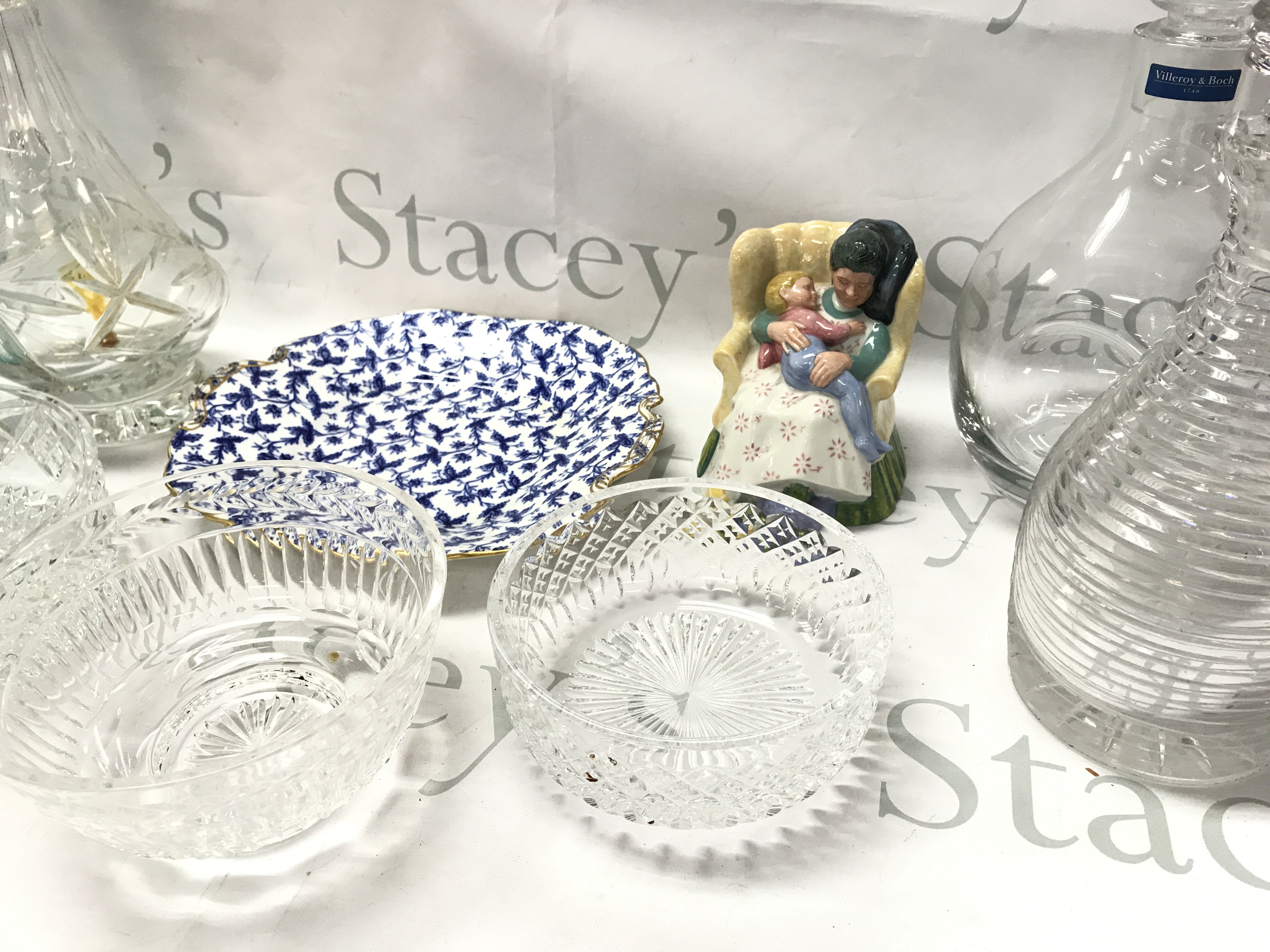 A collection of cut glass decanters and bowls including a Villeroy & Boch decanter, Royal Doulton Sweet dreams figure, Victorian Minton blue floral plate. This lot cannot be posted- NO RESERVE
