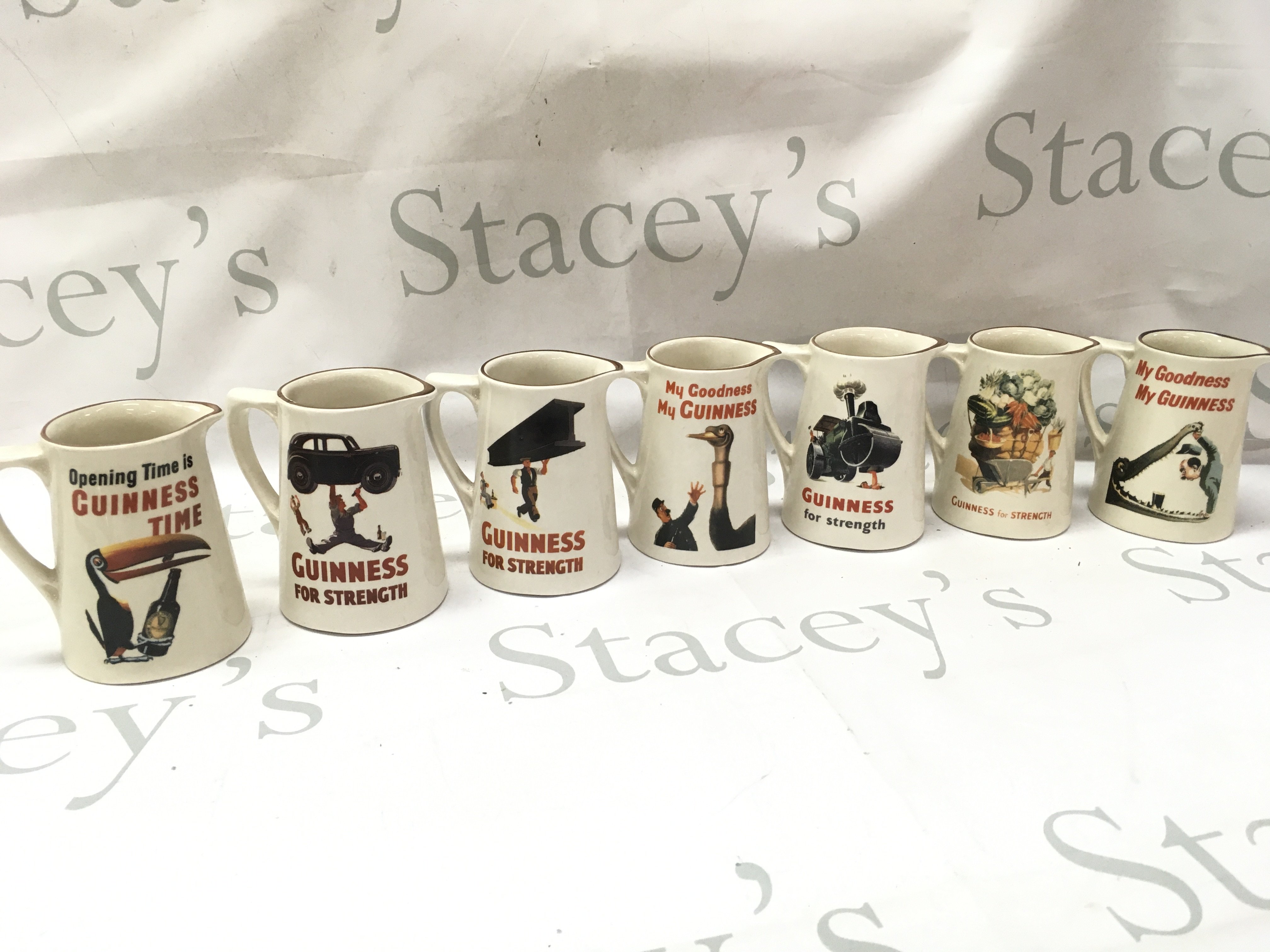 A collection of ceramic bar advertising jugs including Guinness , Marlboro, Stock 84 brandy, Bells Scotch, John Player . This lot cannot be posted