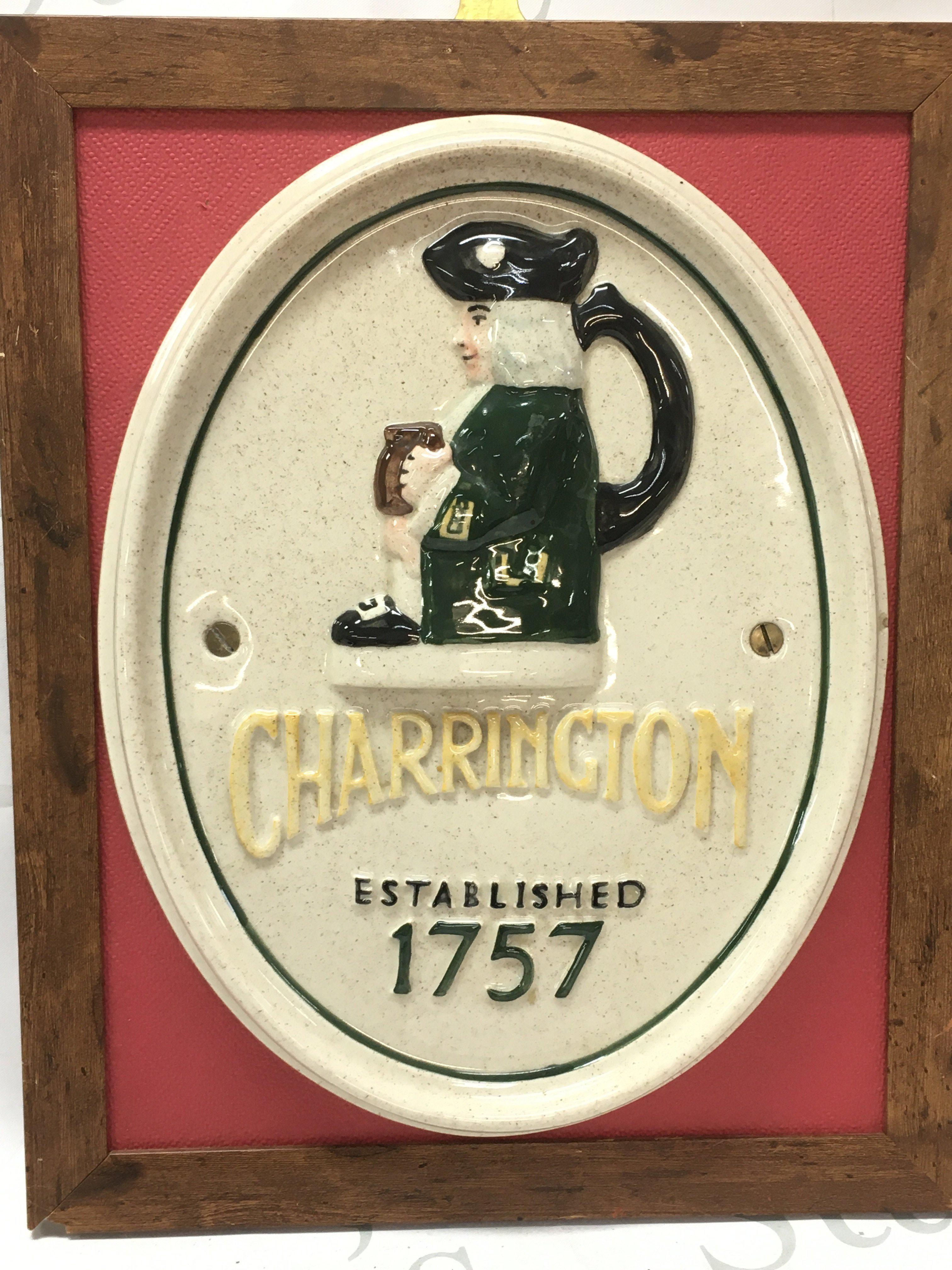 A porcelain Charringtons advertising plaque on a hanging frame . This lot cannot be posted