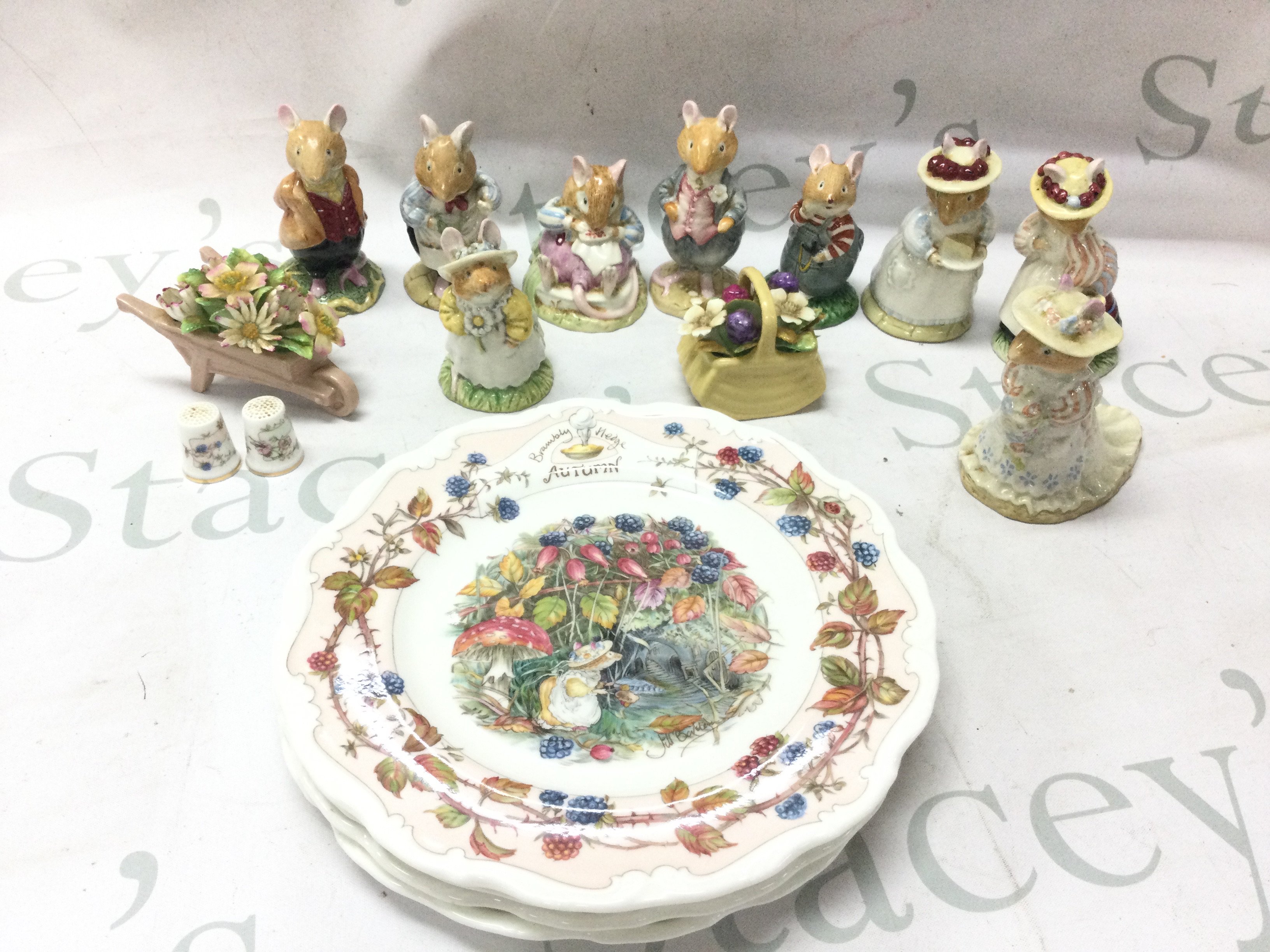 A collection of royal Doulton Brambley Hedge figures and plates. This lot cannot be posted