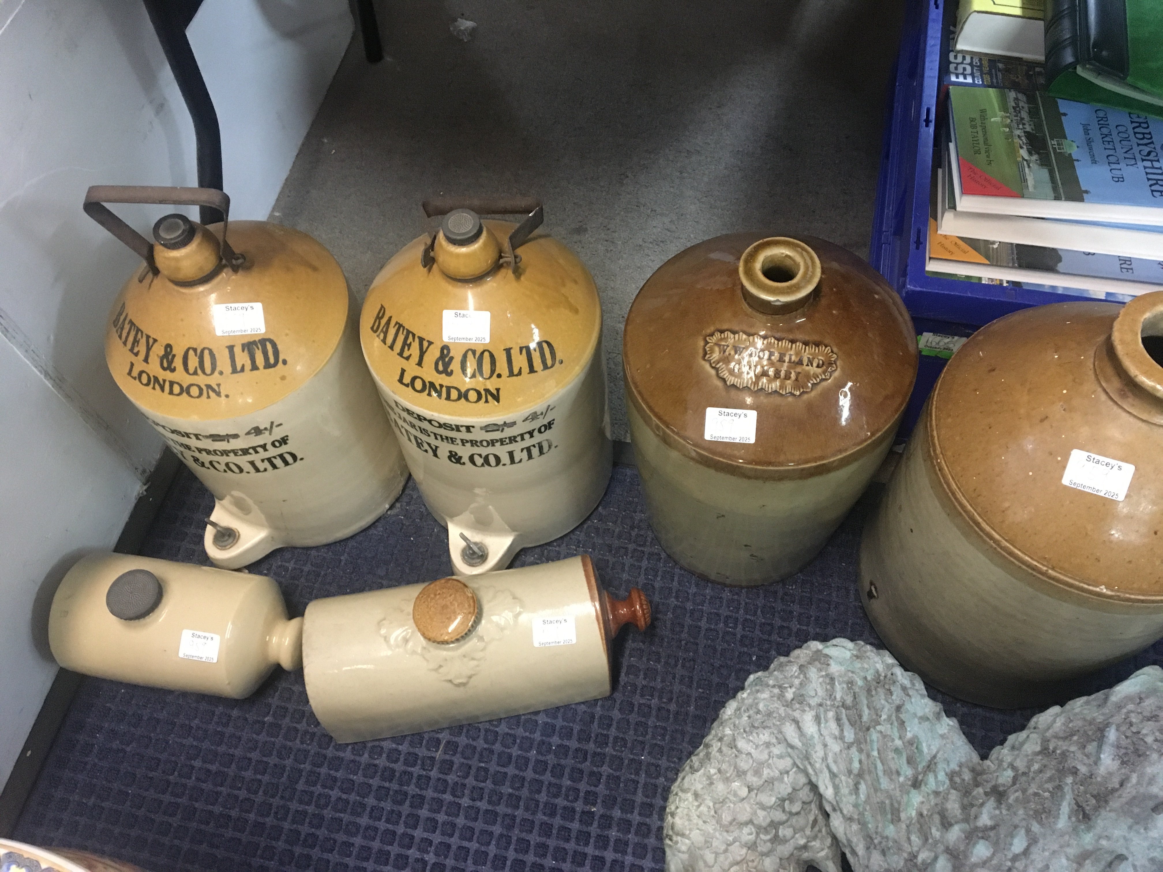 Four stone ware flagons and two hot water bottles