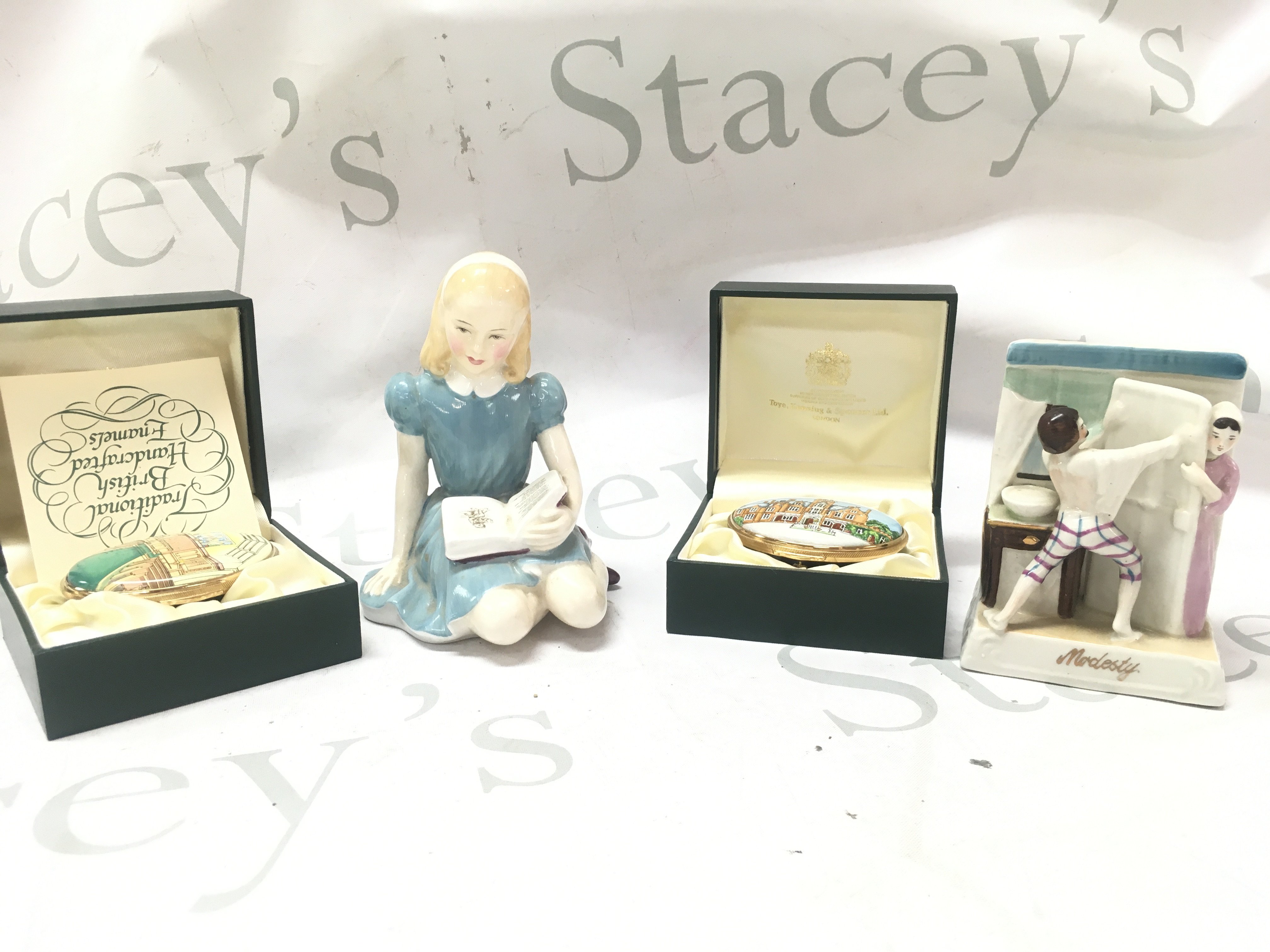 Royal Doulton Alice figure ,two limited edition TKS enamel boxes and a Reproduction Fairing Modesty figure group. This lot cannot be posted