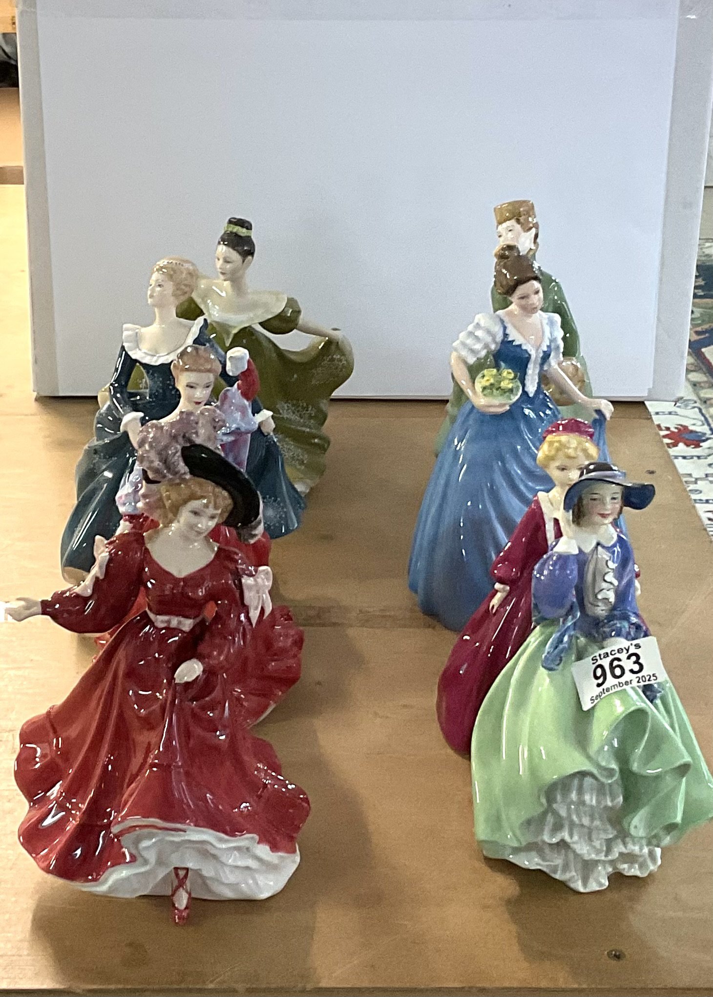 8 Royal Doulton / Royal Worcester porcelain lady figurines.