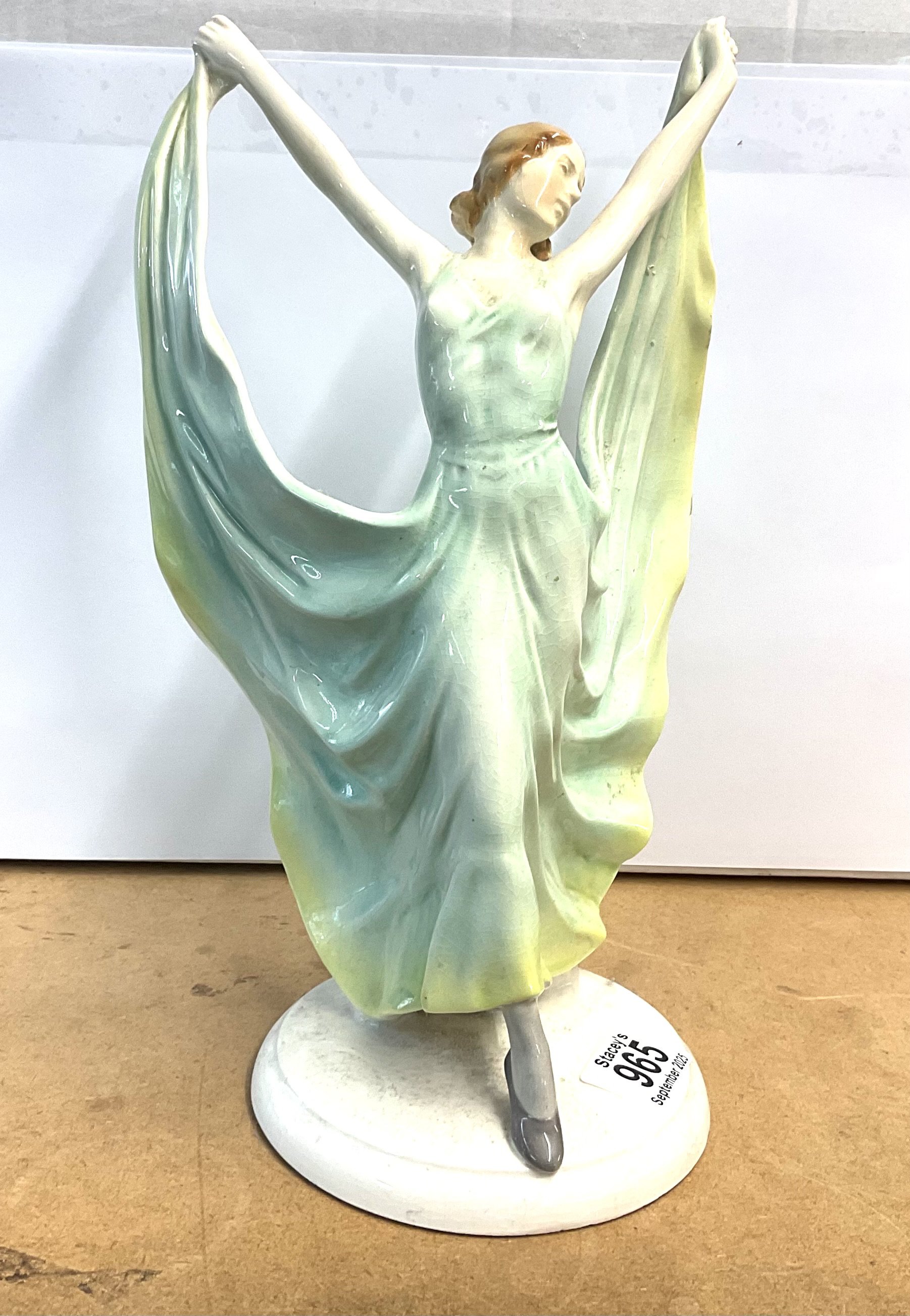 A 1940s Ceramic figure of a dancing lady. 31cm.