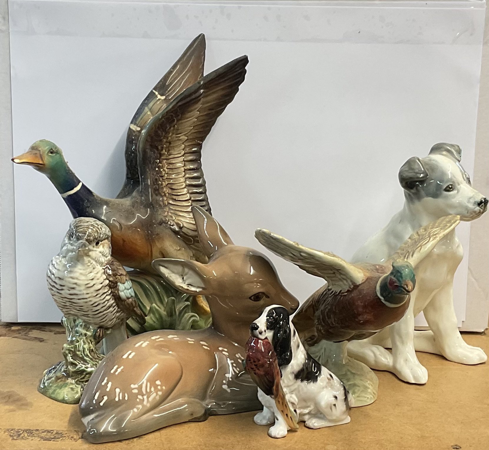 A variety of ceramic animal figures to include Beswick, Midwinter, USSR, Royal Doulton, Jemma.