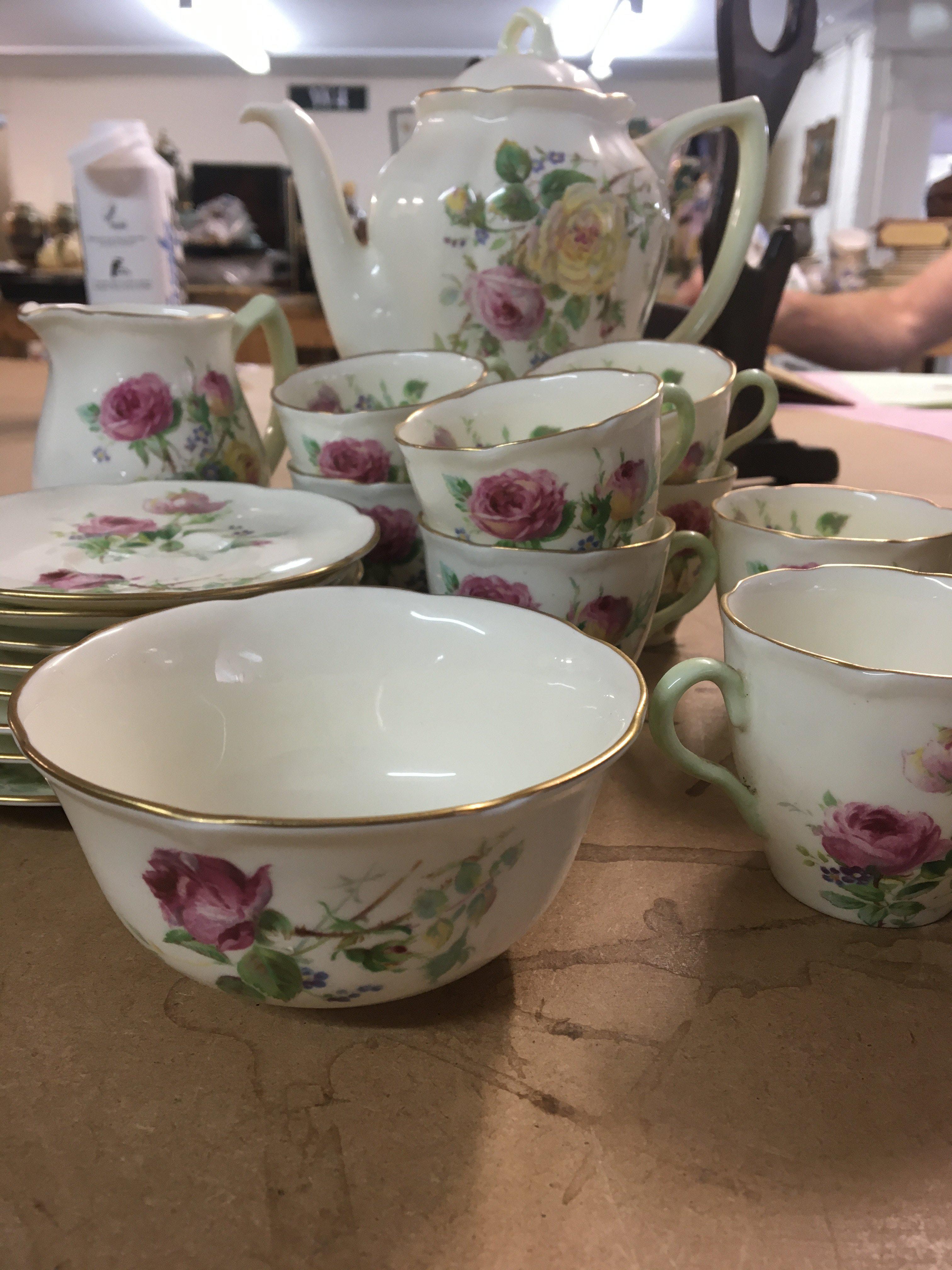 A Royal Doulton coffee set moss rose .