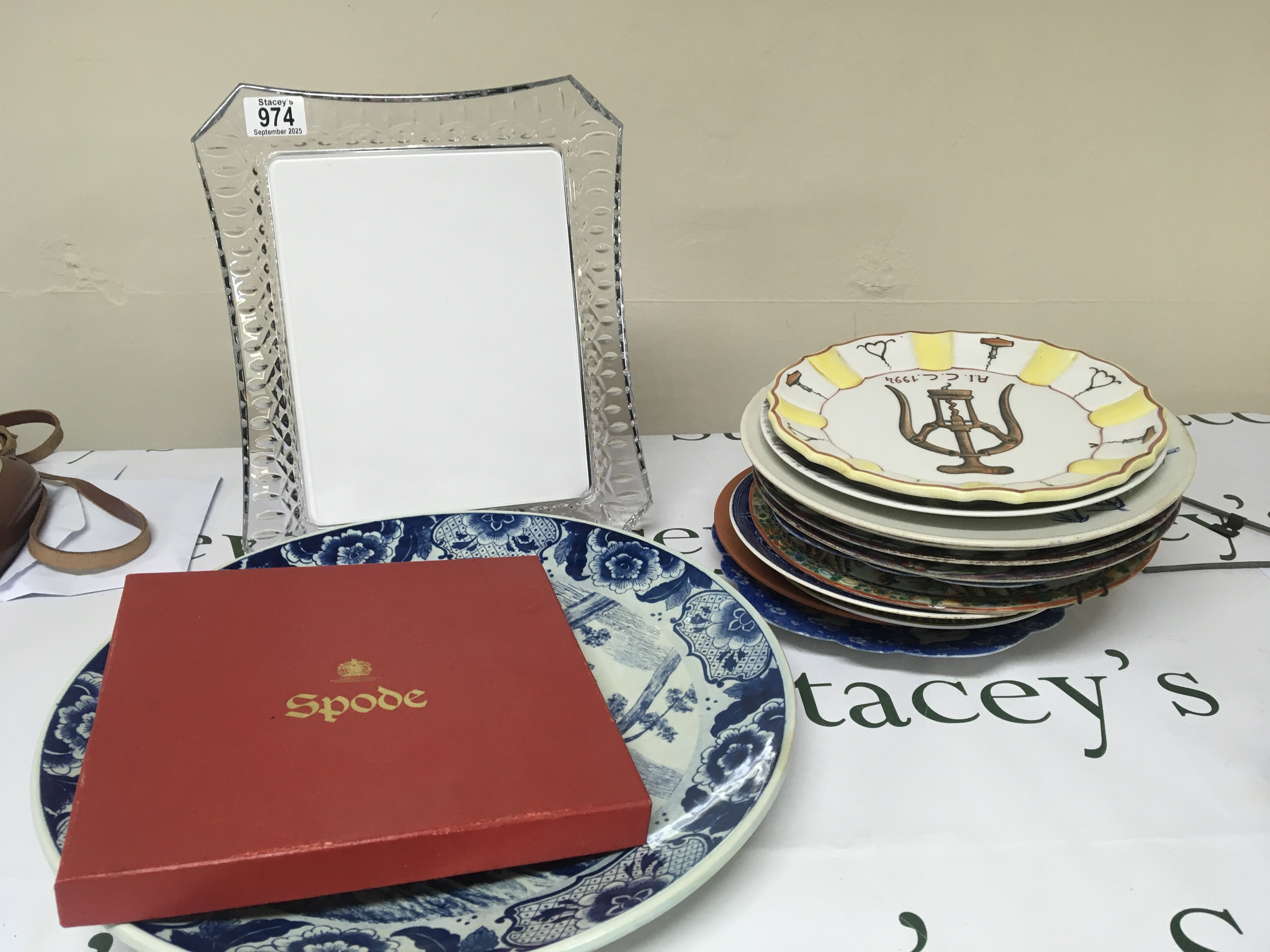 A Waterford cut glass picture frame a quantity of boxed cut glass and a quantity of decorative plates and a blue and white Royal Doulton jug.