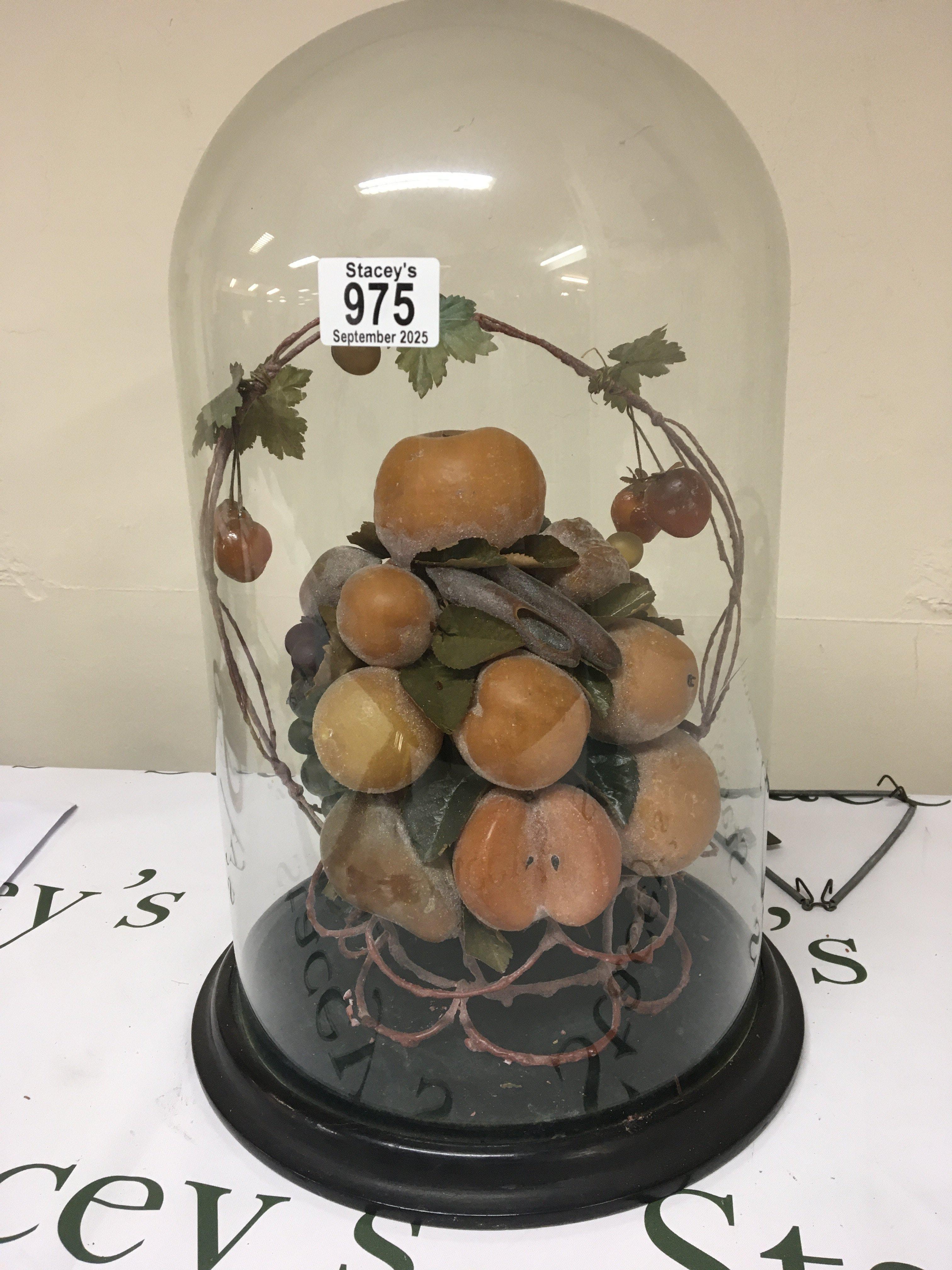 A glass dome enclosing a display of fruit. No damage to the glass dome height 45cm