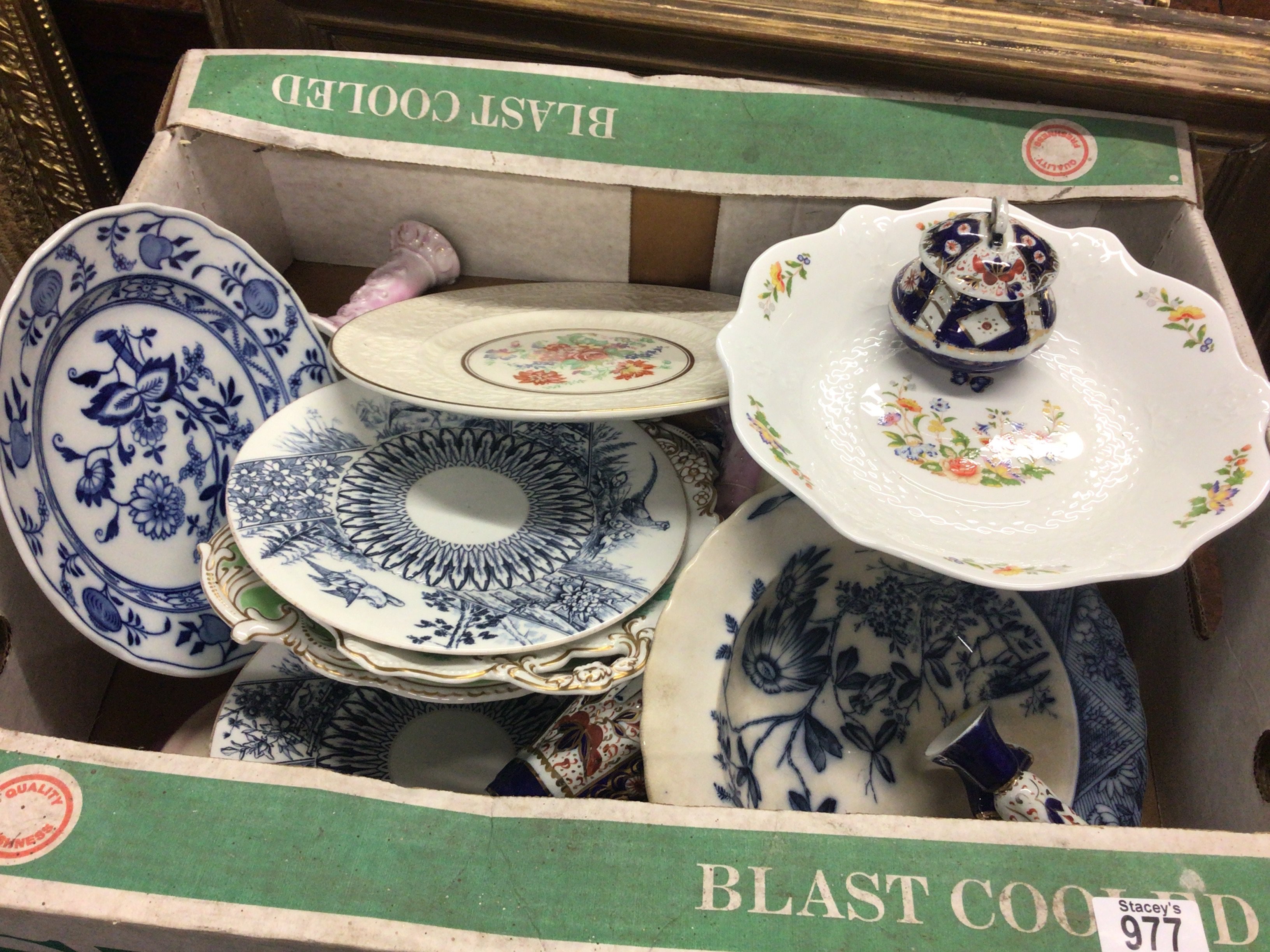 A box containing decorative ceramics plates vases and candle sticks No Reserve