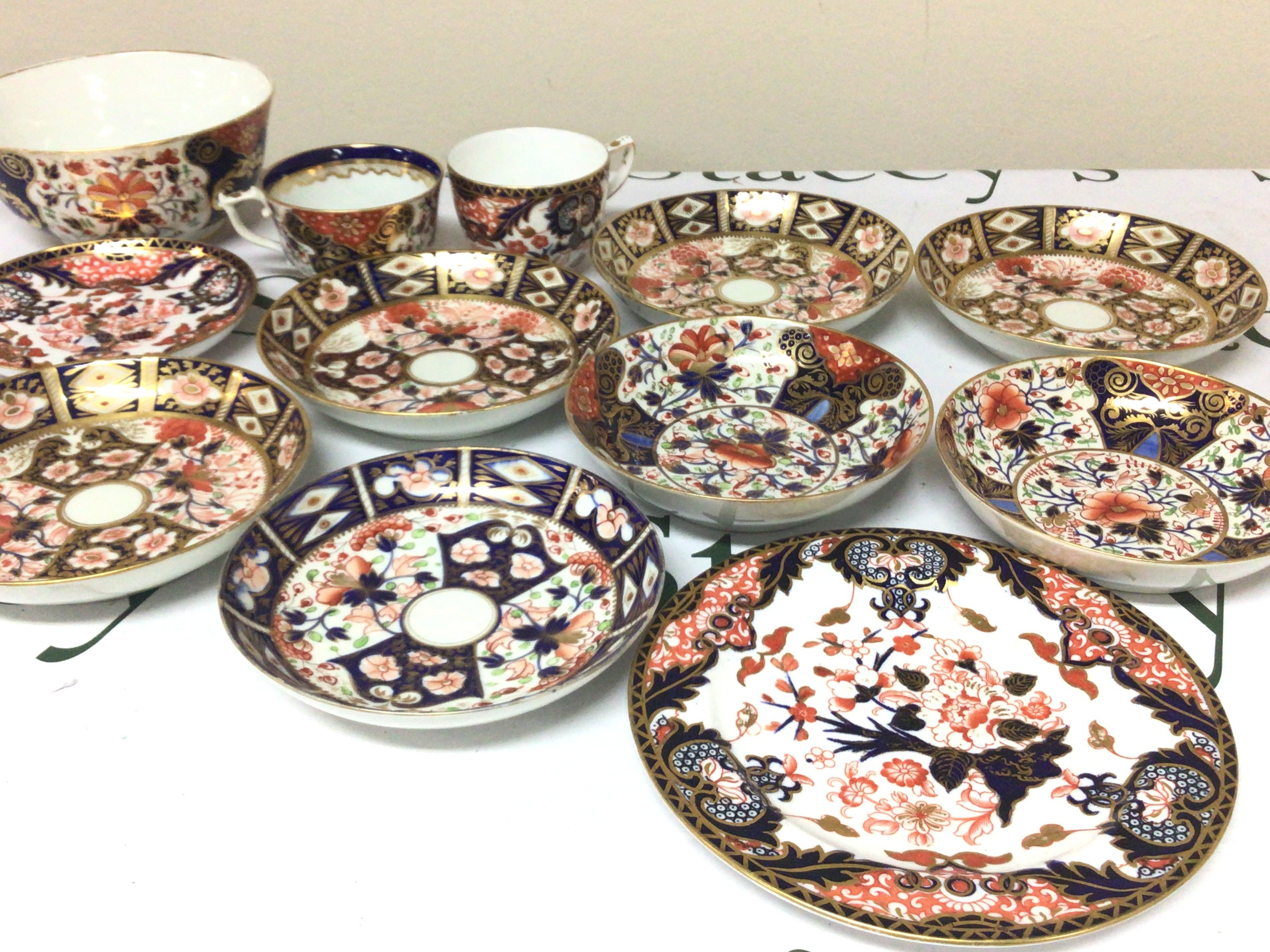 A collection of 19th century Royal Crown Derby Imari pattern porcelain a set of four dishes pairs of dishes a bowl and others no obvious damage except very minor gilt rubbing.